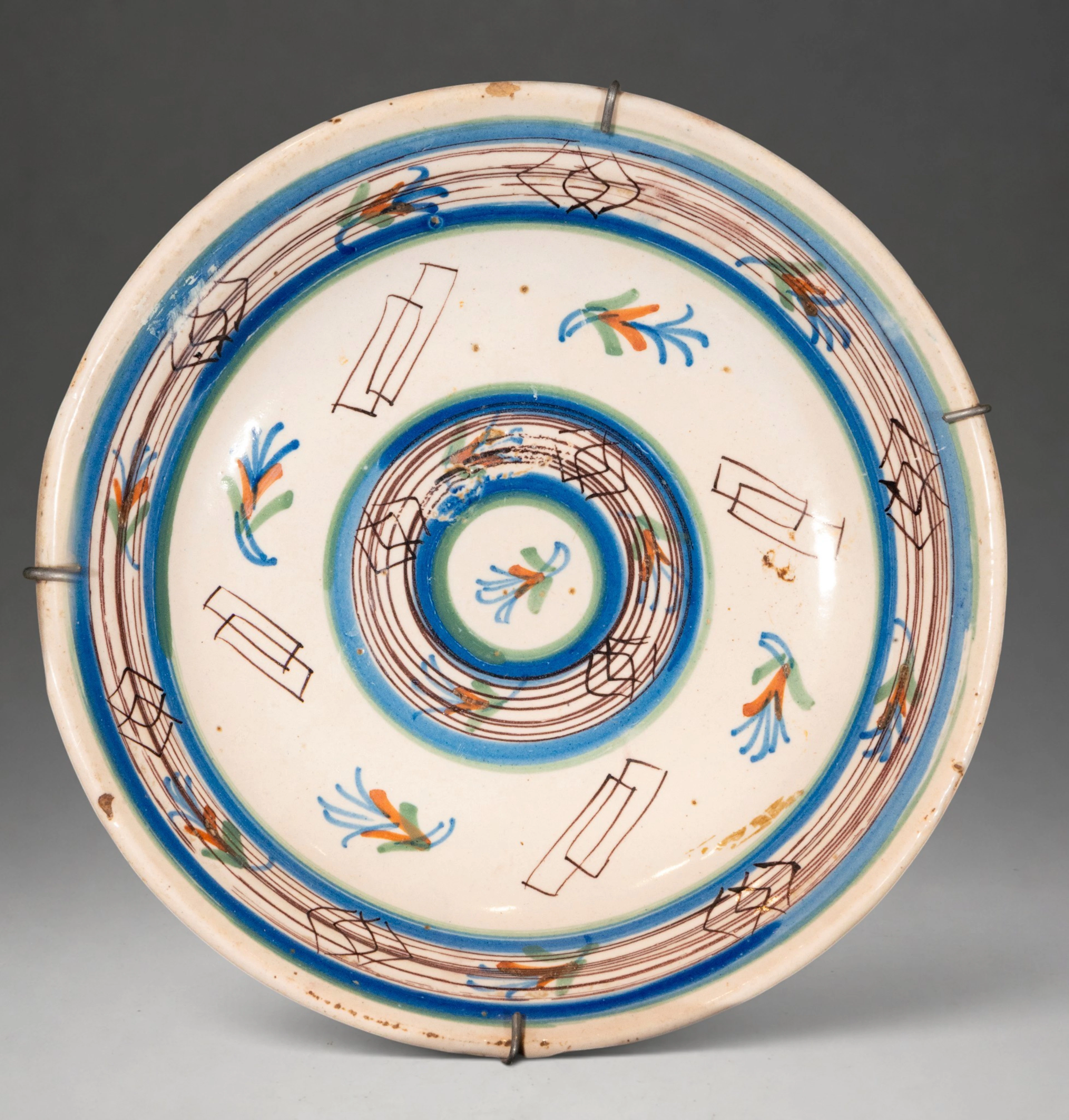 MANISES CERAMICS - Plate with polychrome geometric and vegetal decoration