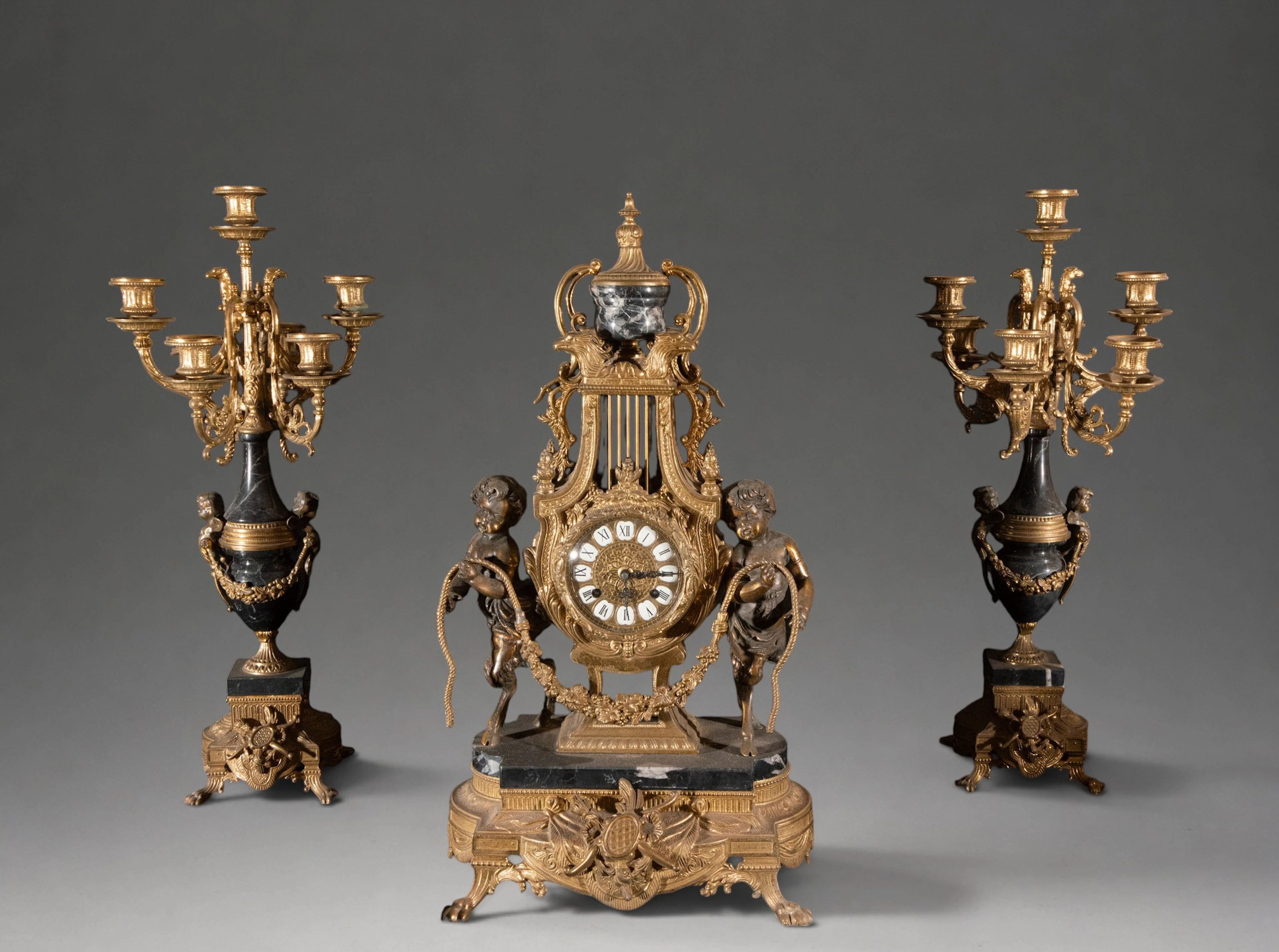 Set of large Napoleon III clock and pair of Ormolu candlesticks –