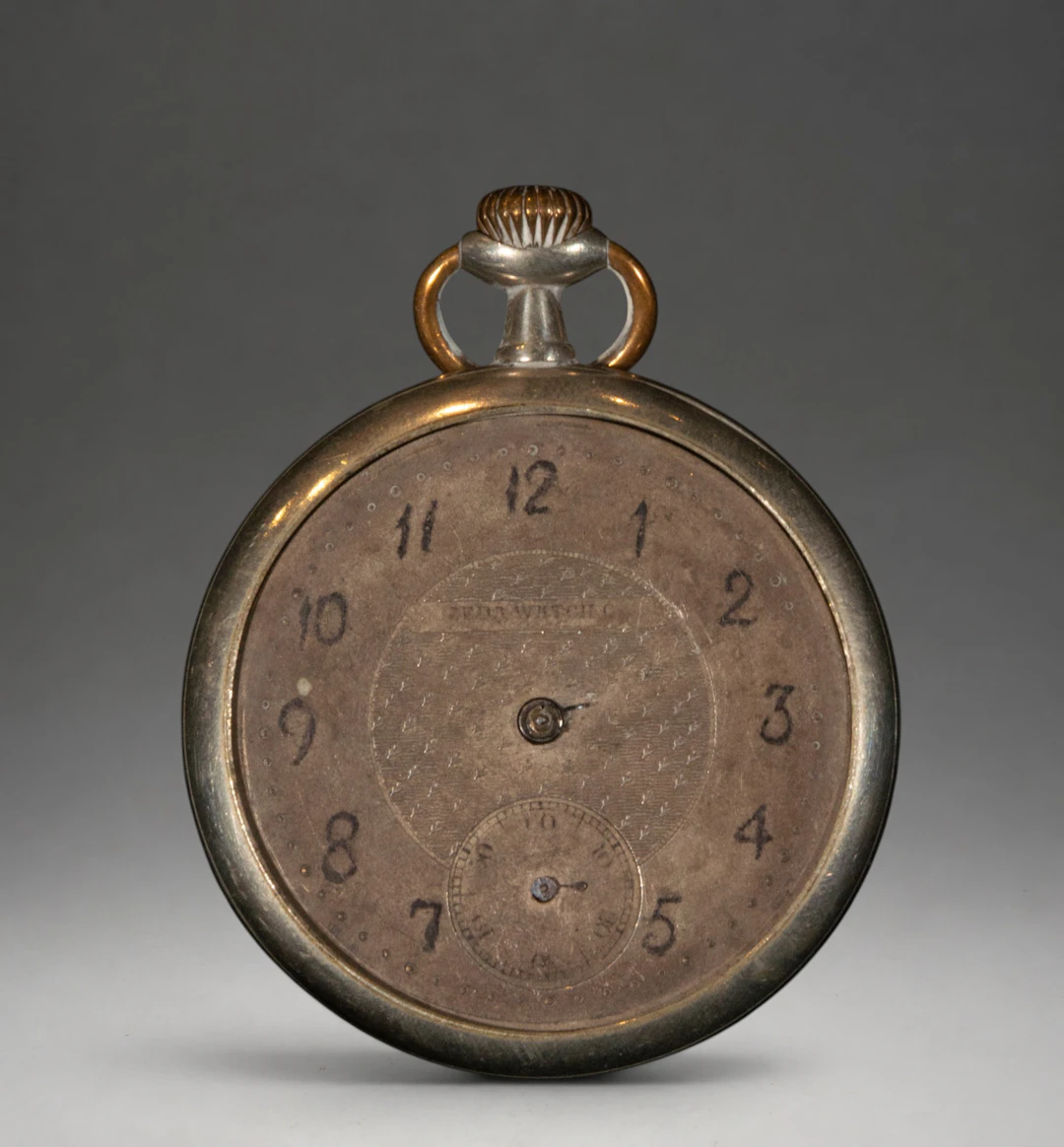 Pocket watch with Arabic numerals and silver case
