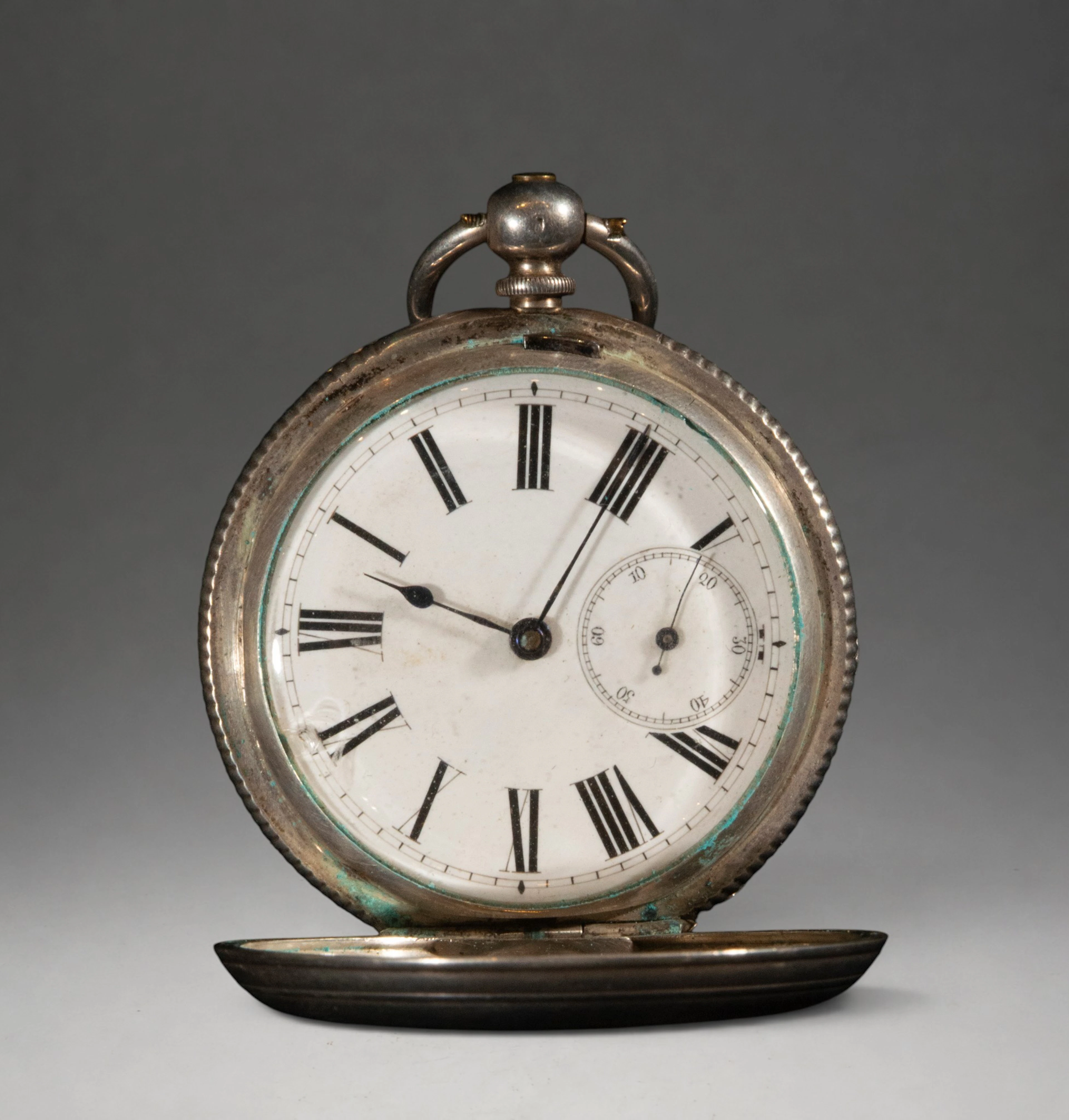 Pocket watch with hinged cover and Roman numeral dial