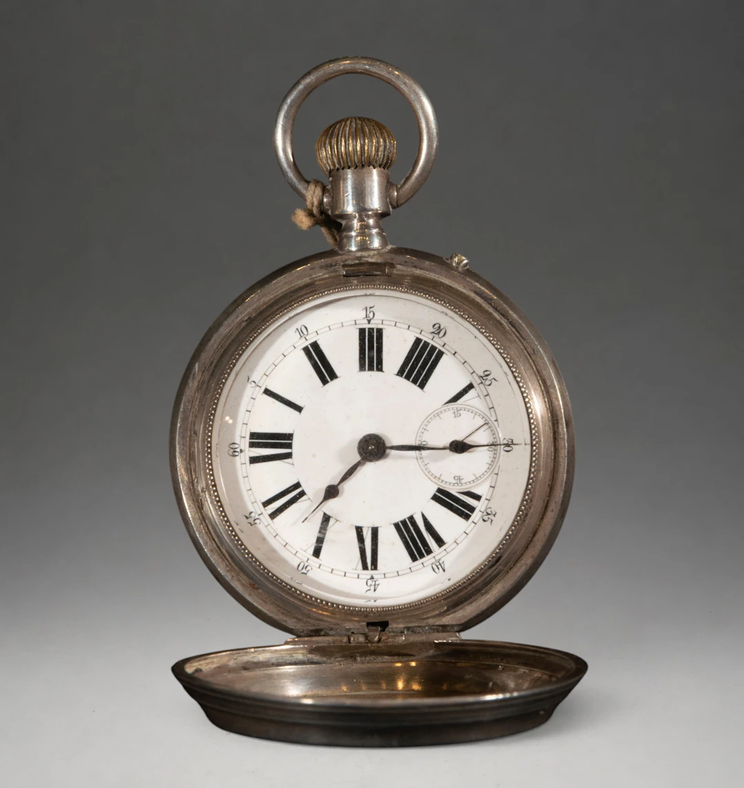 Pocket watch with hinged cover and Roman numerals