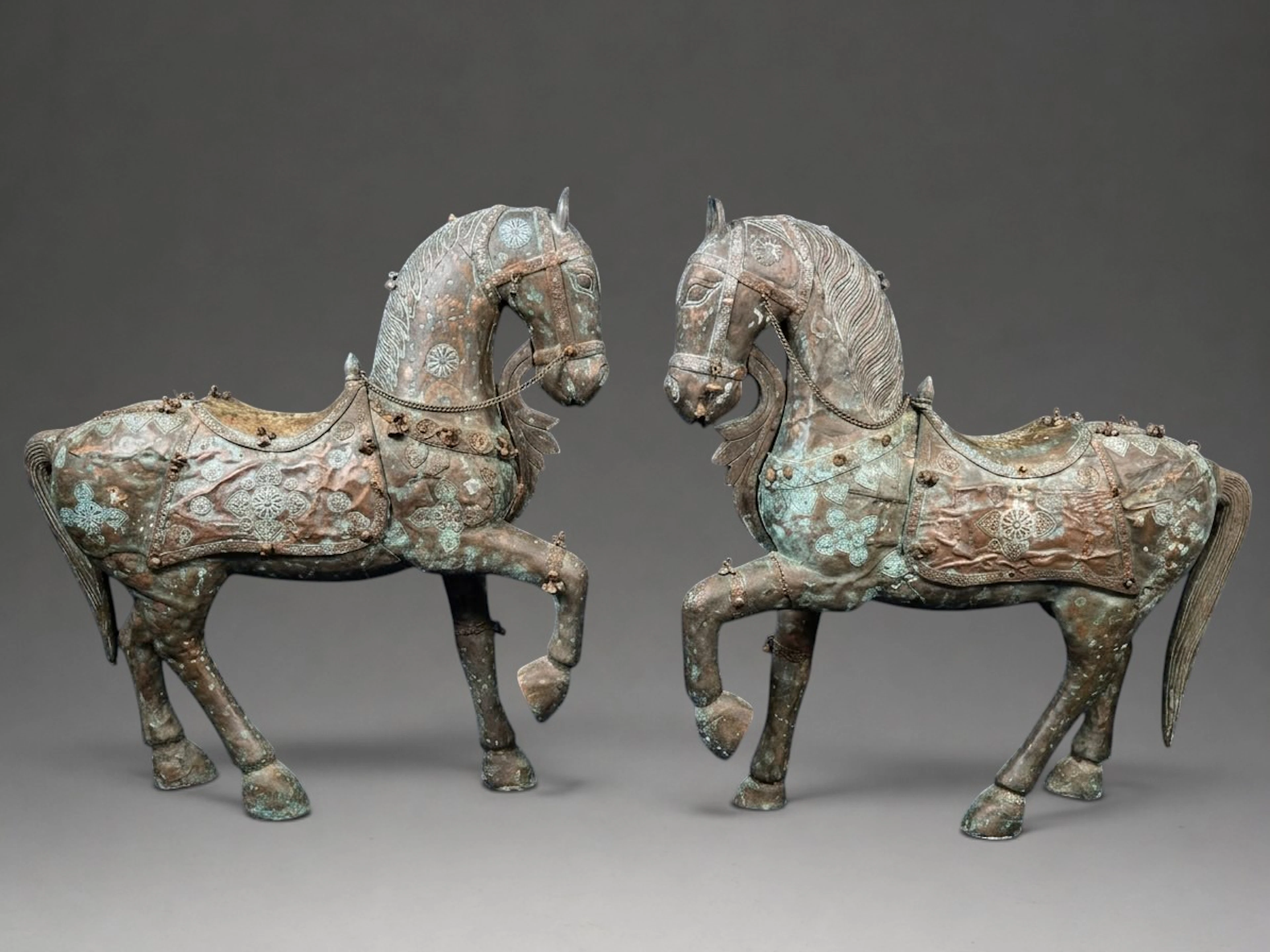 LARGE PAIR OF INDIAN HORSES MADE OF WOOD AND COVERED IN COPPER AND BRASS