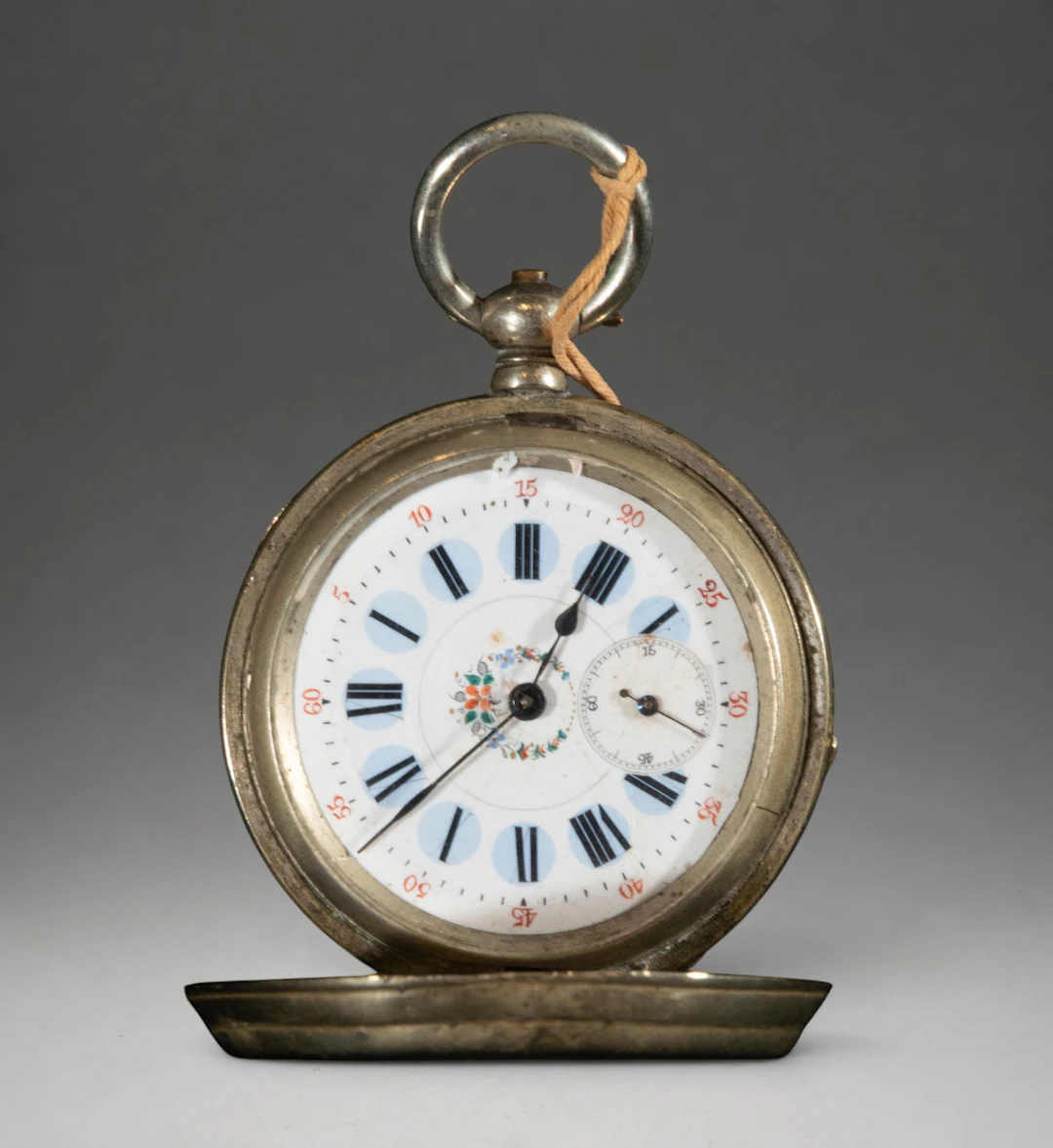 Pocket watch with hinged cover and Roman numeral dial