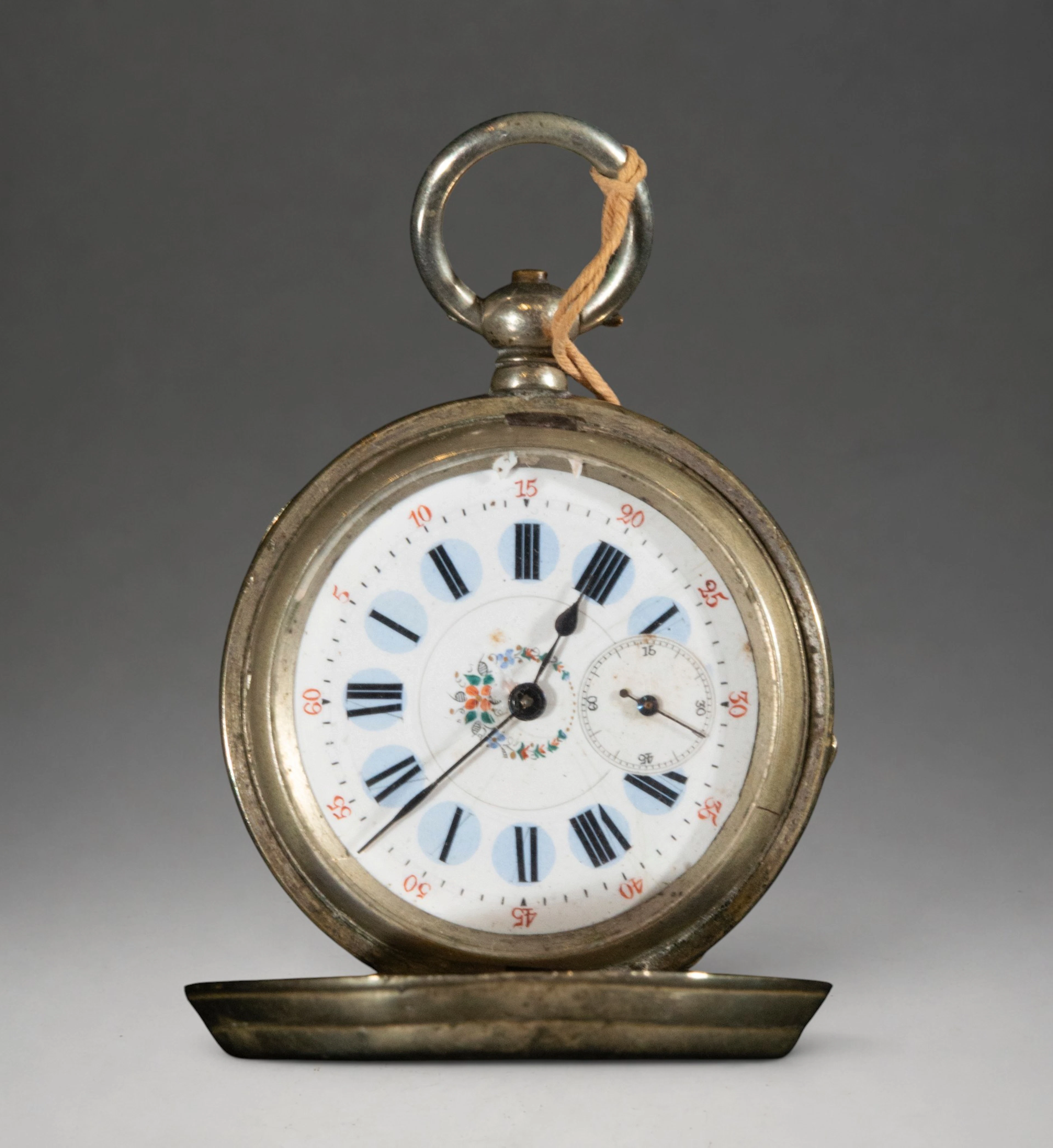 Pocket watch with hinged cover and Roman numeral dial