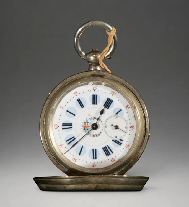 Pocket watch with hinged cover and Roman numeral dial