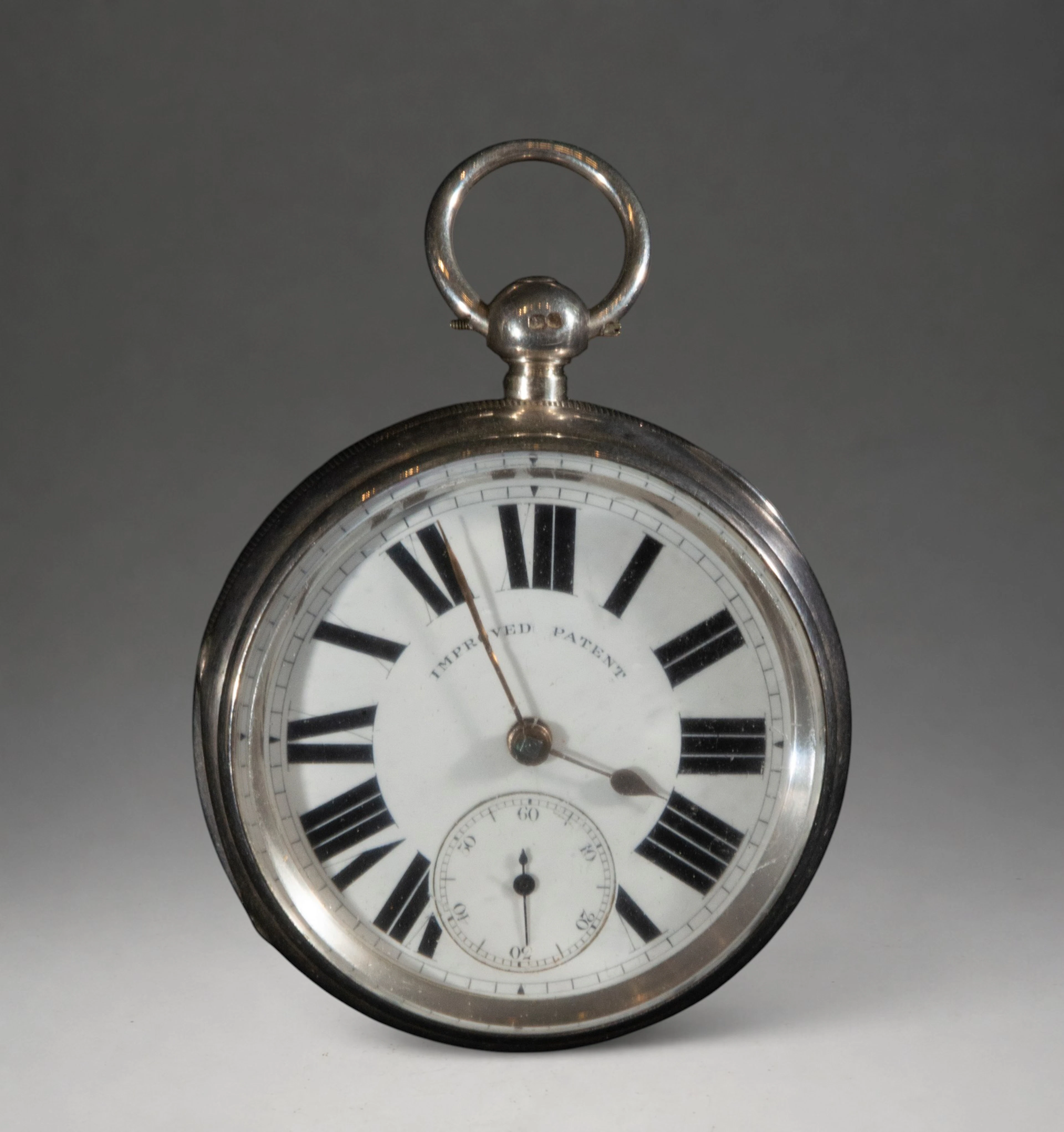 Pocket watch with white dial and Roman numerals