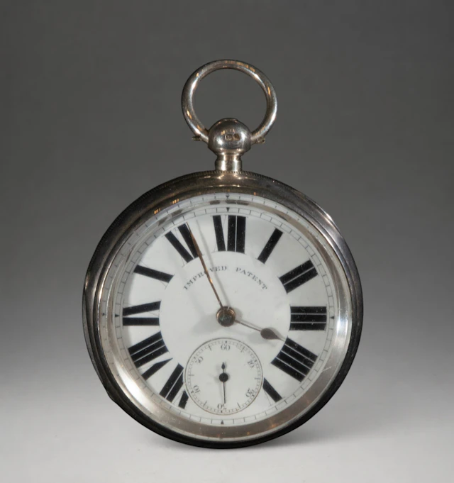 Pocket watch with white dial and Roman numerals