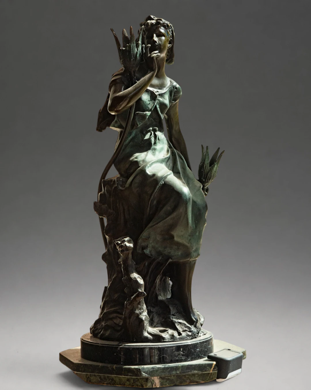 Female figure seated among vegetation, signed – late 19th-early 20th century