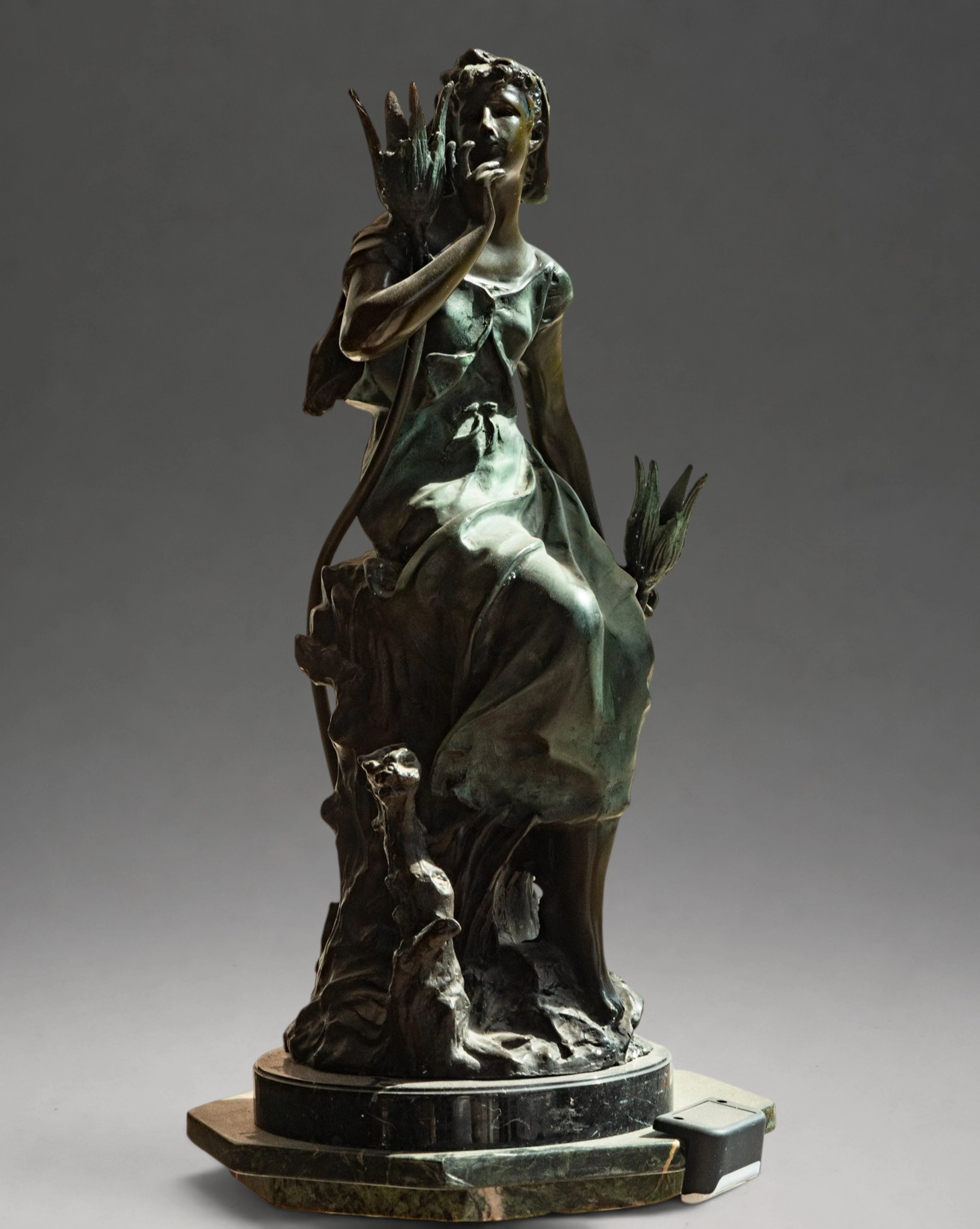 Female figure seated among vegetation, signed – late 19th-early 20th century