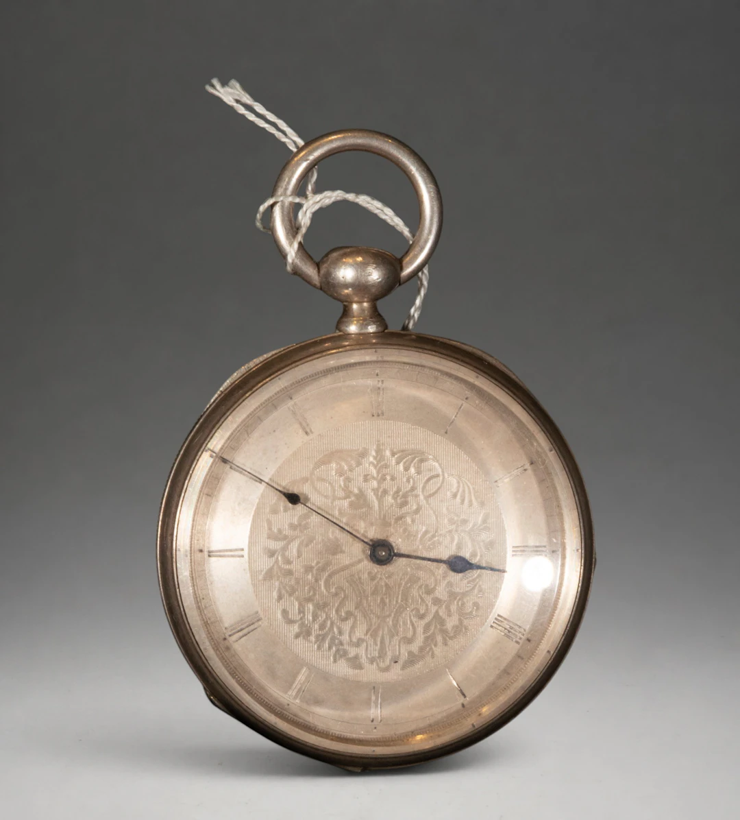 Pocket watch with decorated dial and Roman numerals