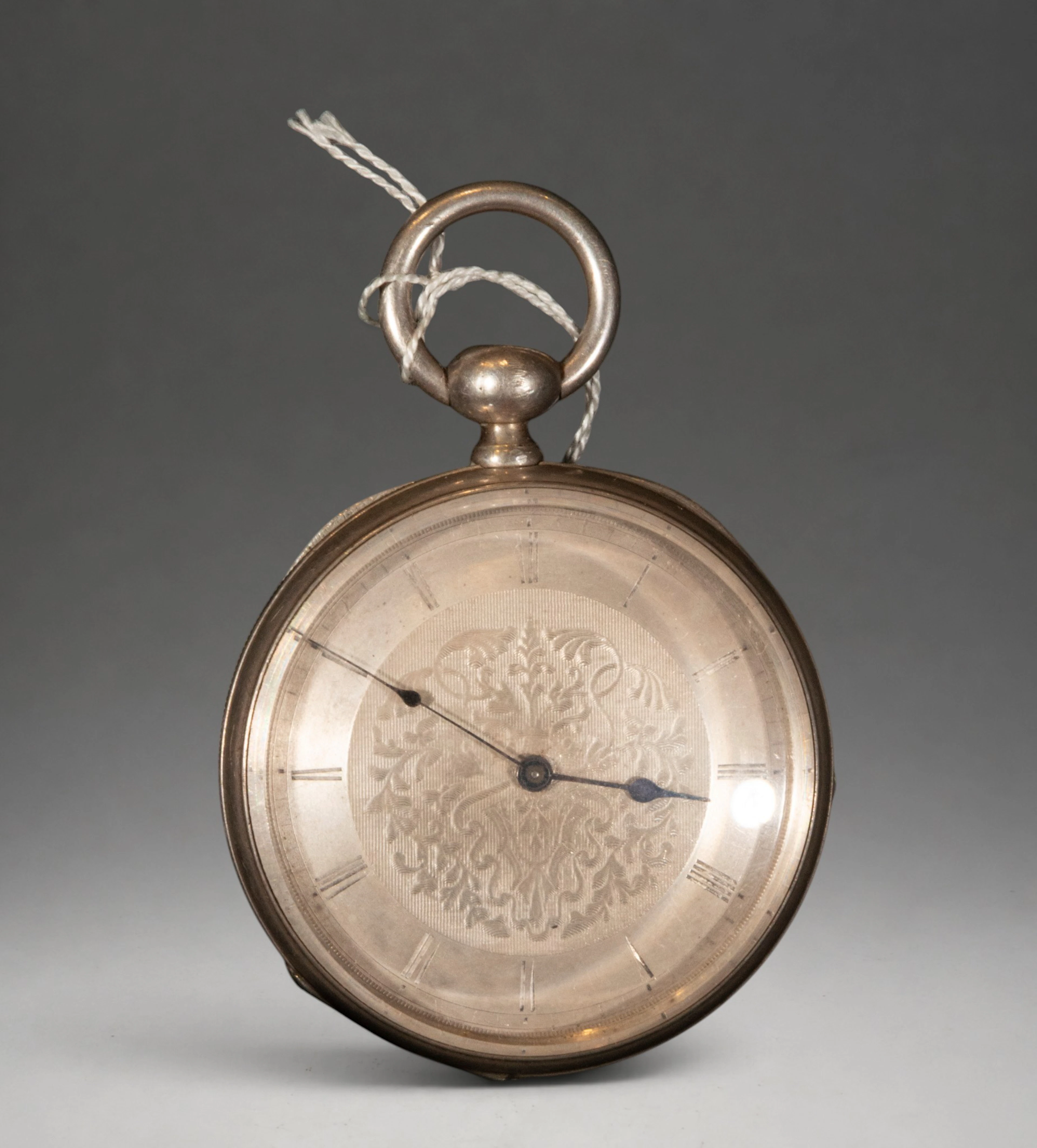 Pocket watch with decorated dial and Roman numerals