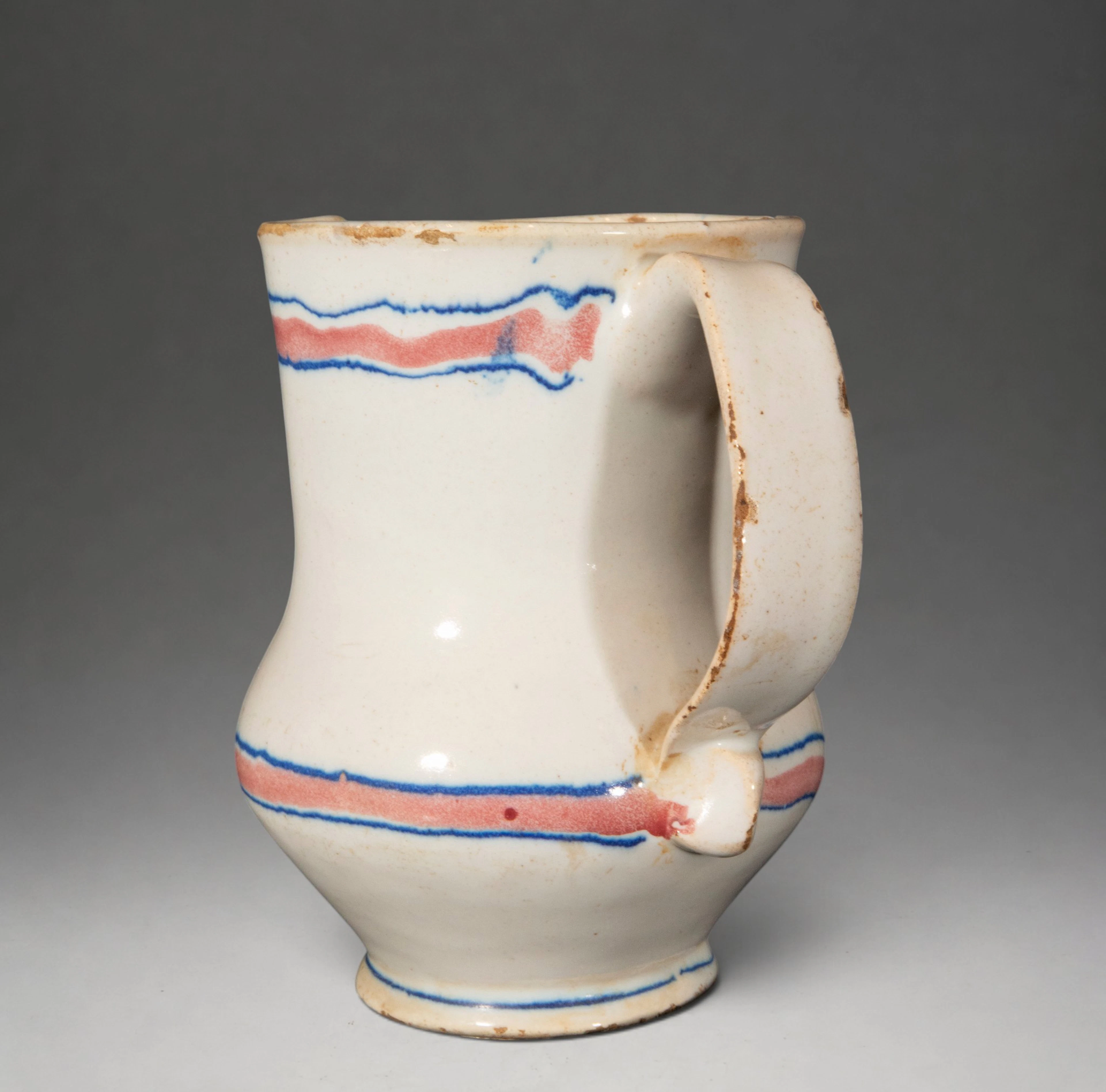 MANISES CERAMICS - Jug with blue and red border decoration