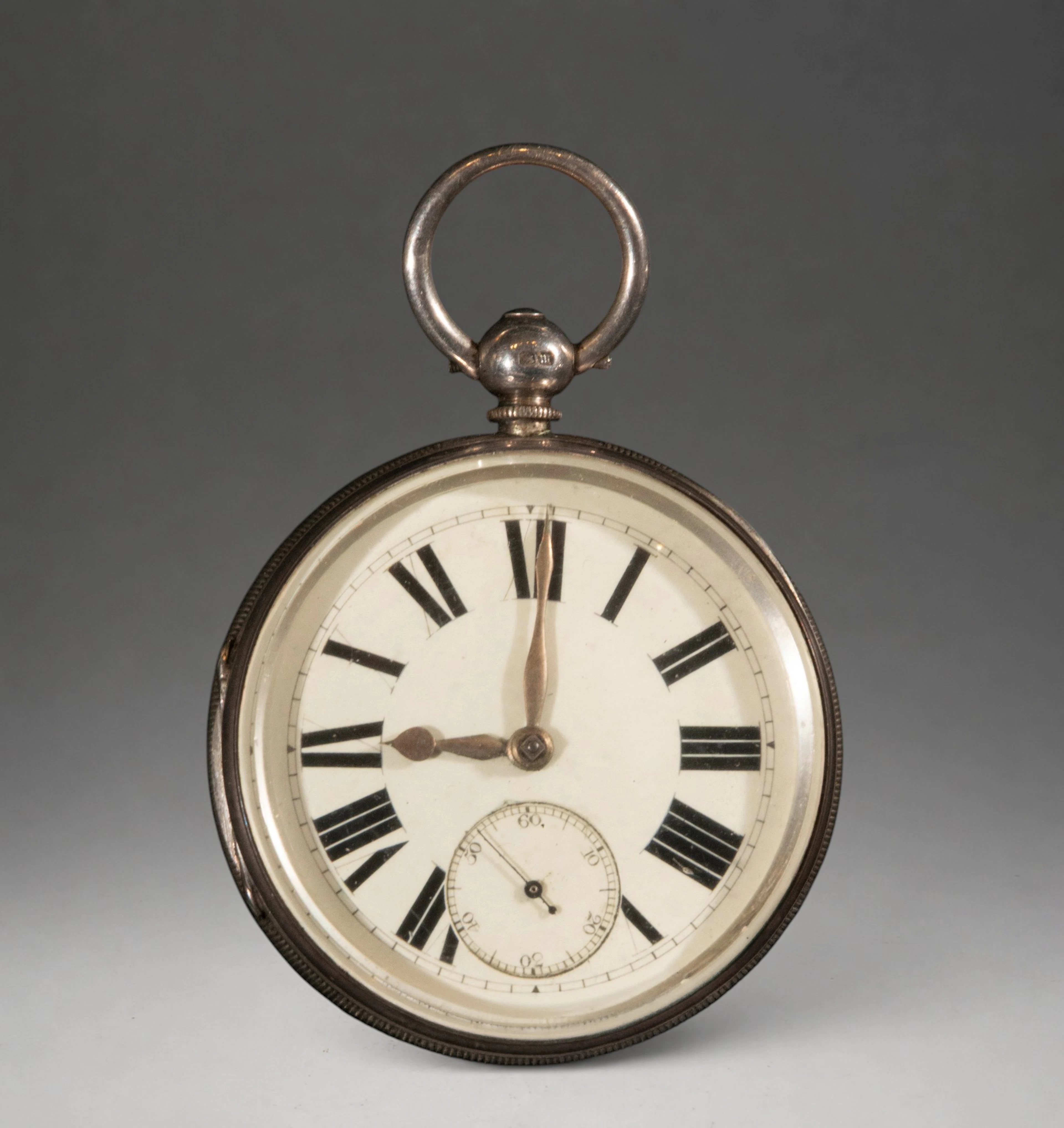 Pocket watch with white dial and Roman numerals
