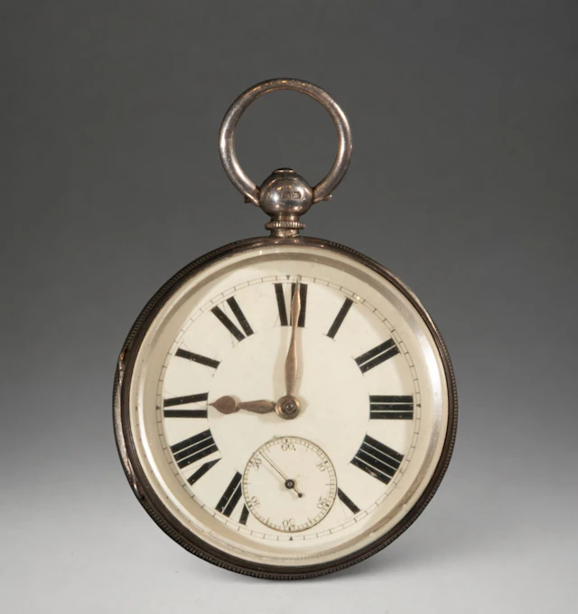 Pocket watch with white dial and Roman numerals