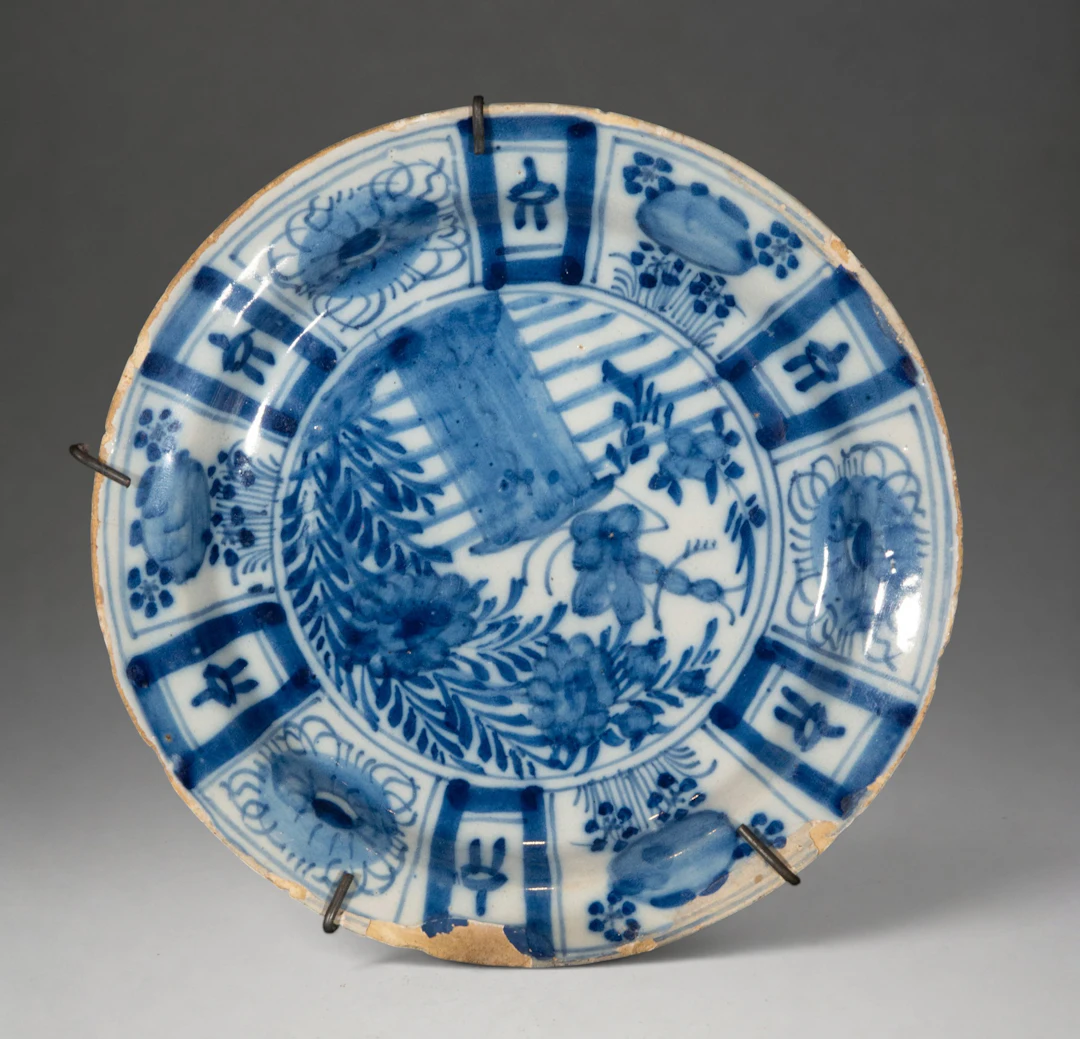 MANISES CERAMICS - Plate with orientalizing decoration in blue and white
