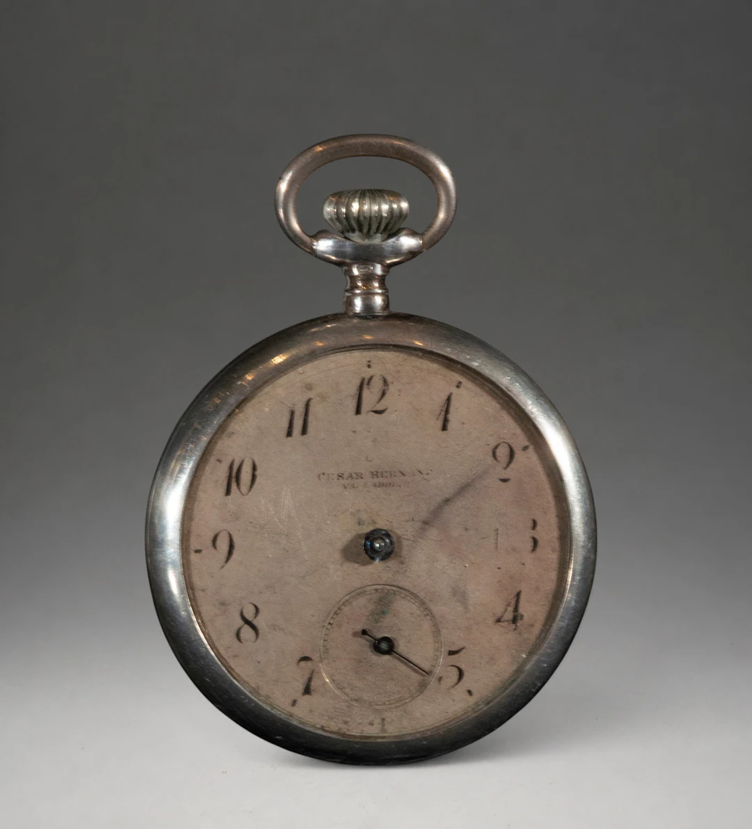 Pocket watch with an ivory-toned dial