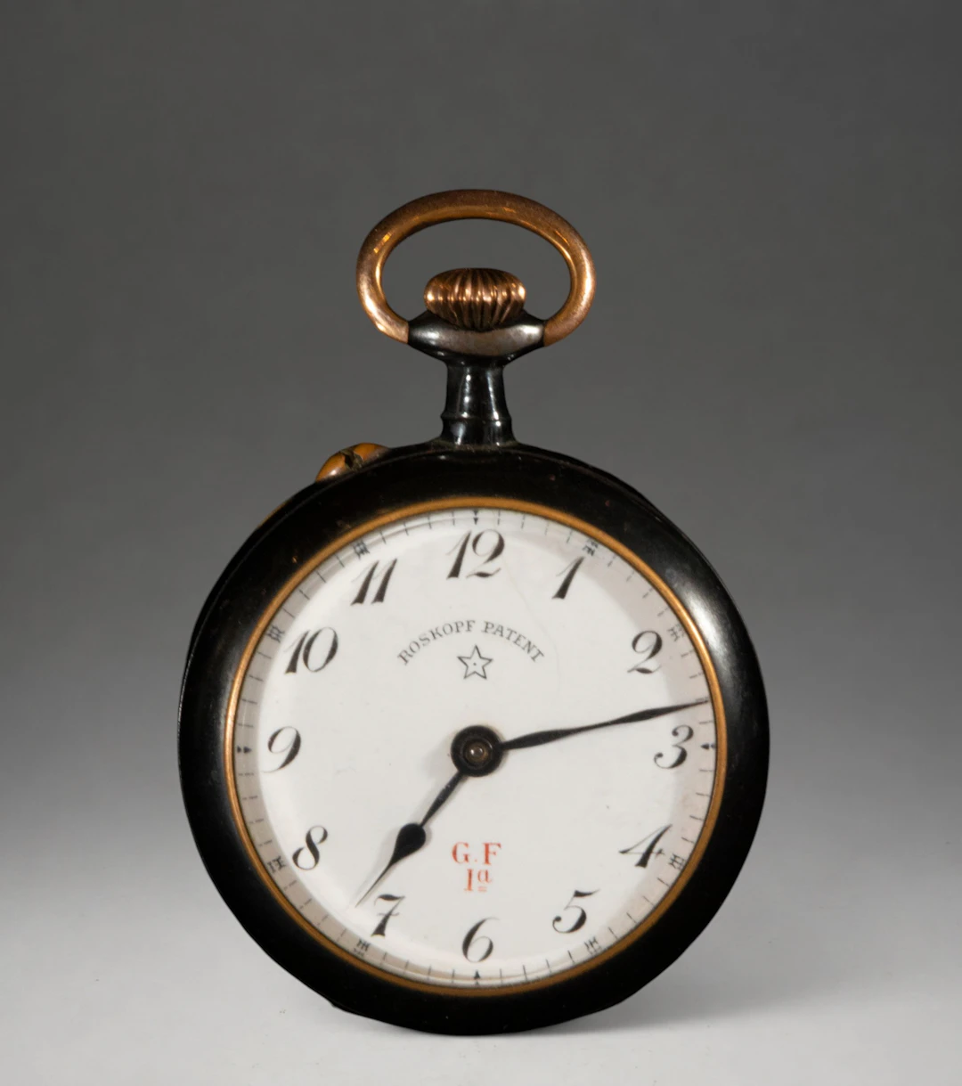 Pocket watch with white dial and dark case