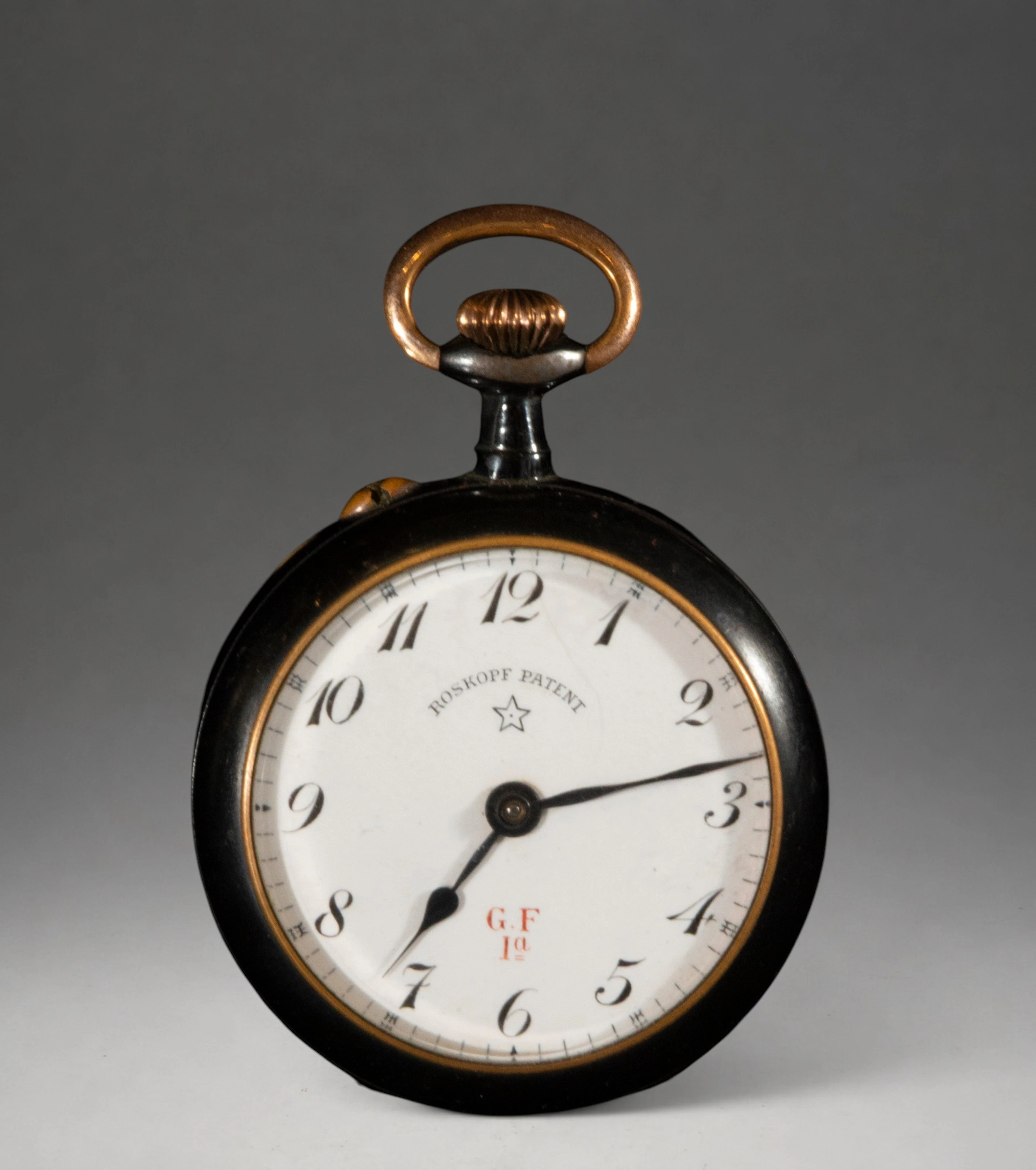 Pocket watch with white dial and dark case