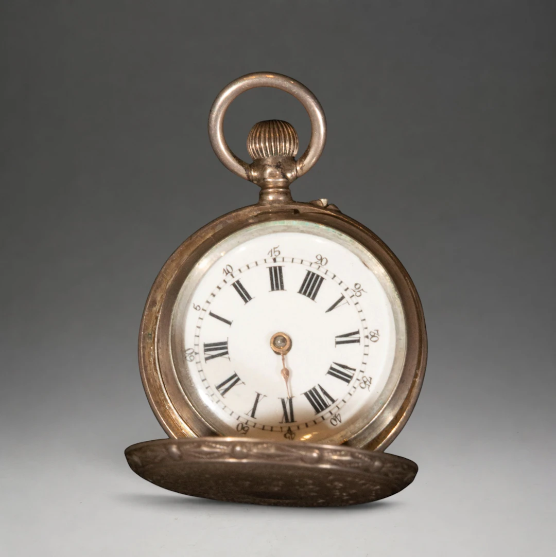 Small pocket watch with Roman numerals