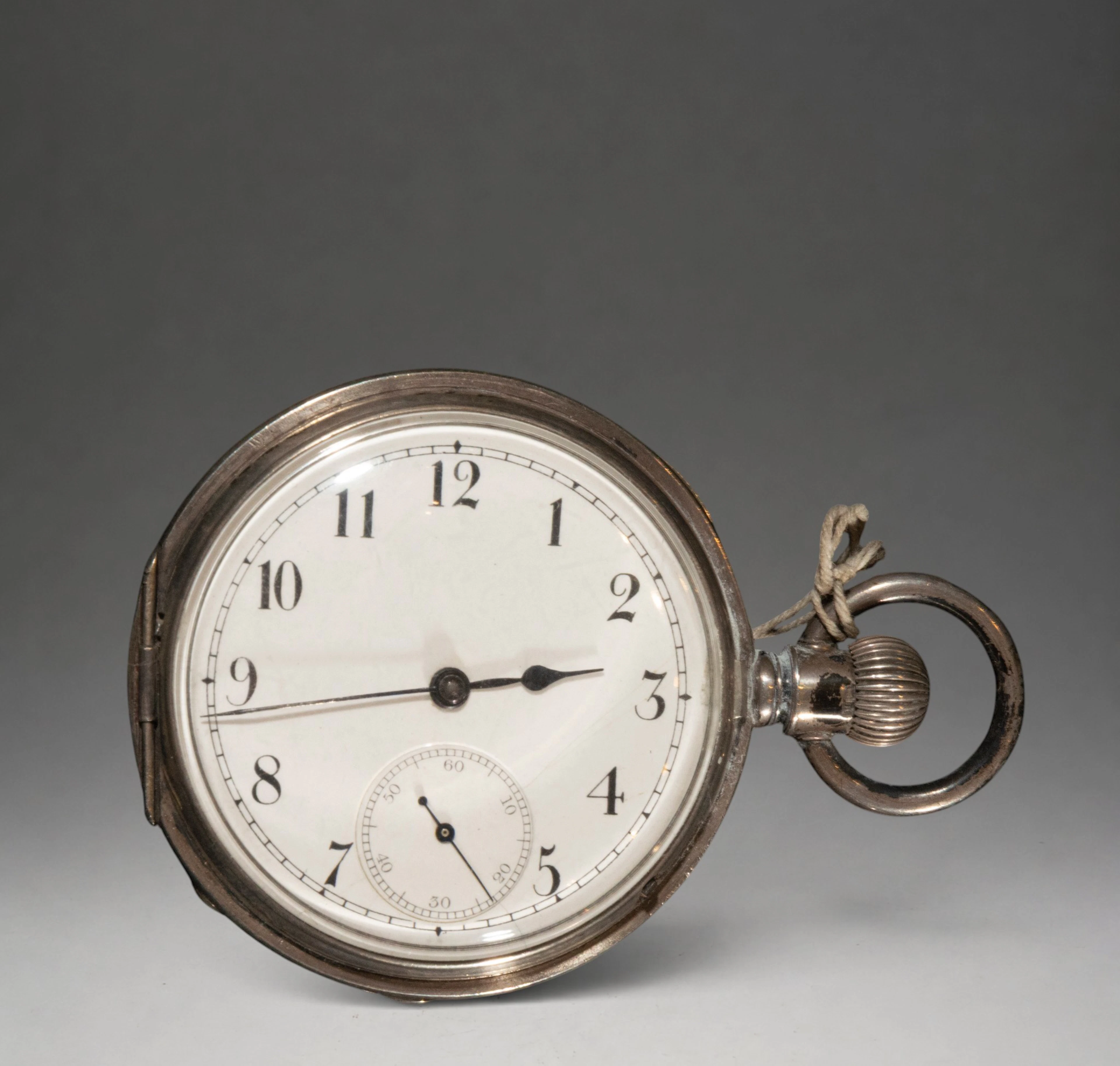 Pocket watch with white dial and Arabic numerals
