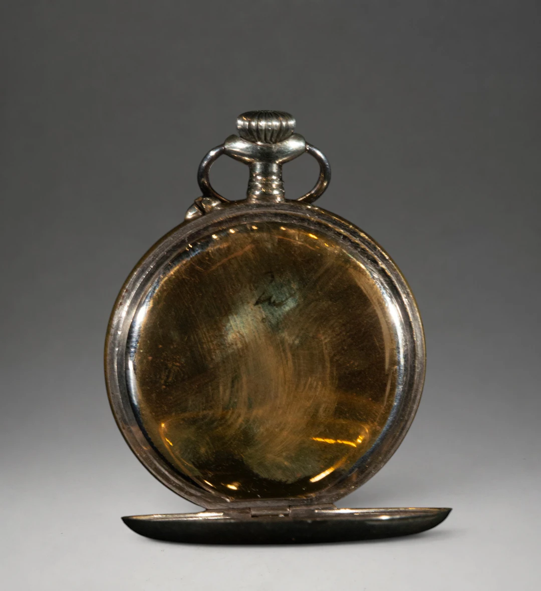 Pocket watch with gold case and hinged lid