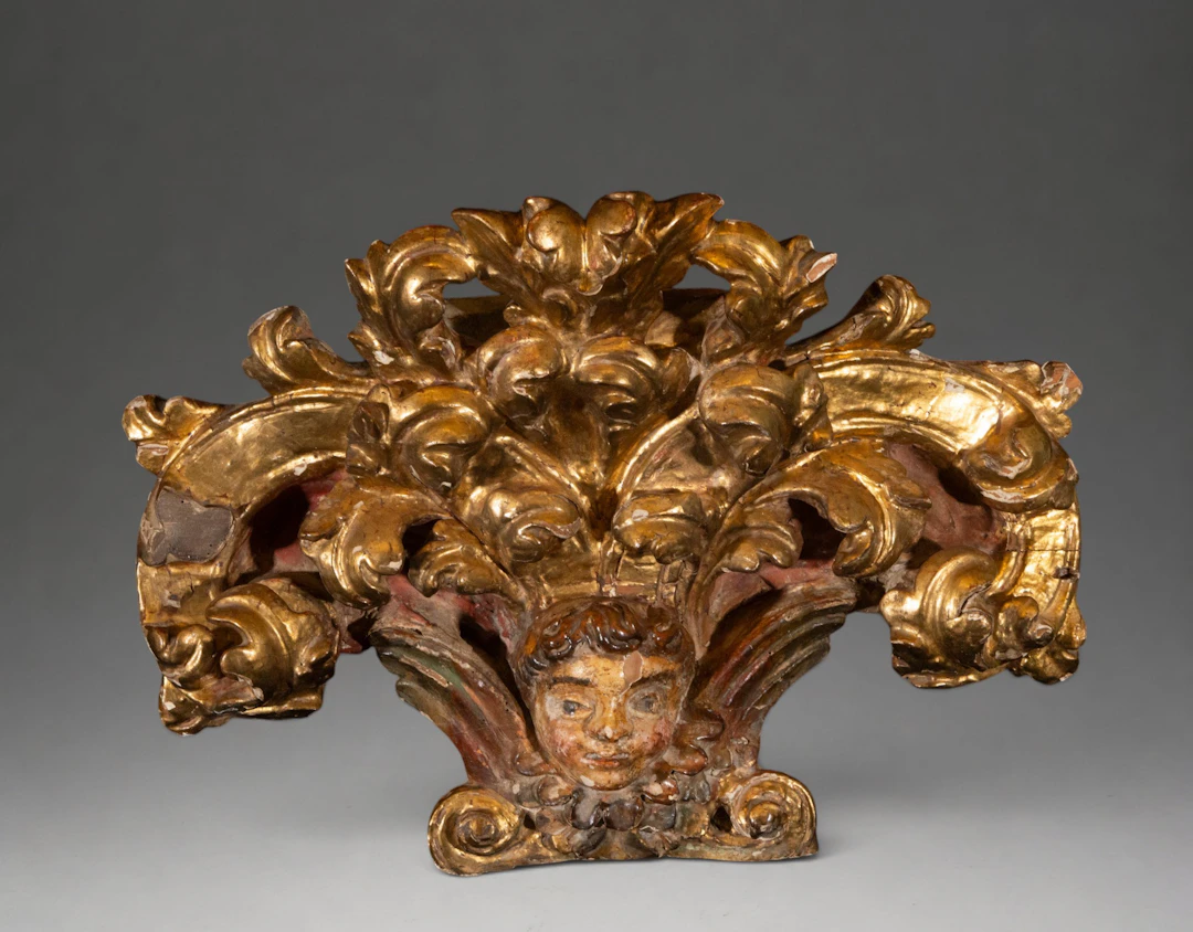 Ornamental carving with cherub head and acanthus leaves – Spanish