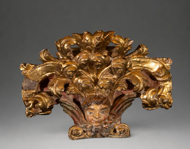 Ornamental carving with cherub head and acanthus leaves – Spanish
