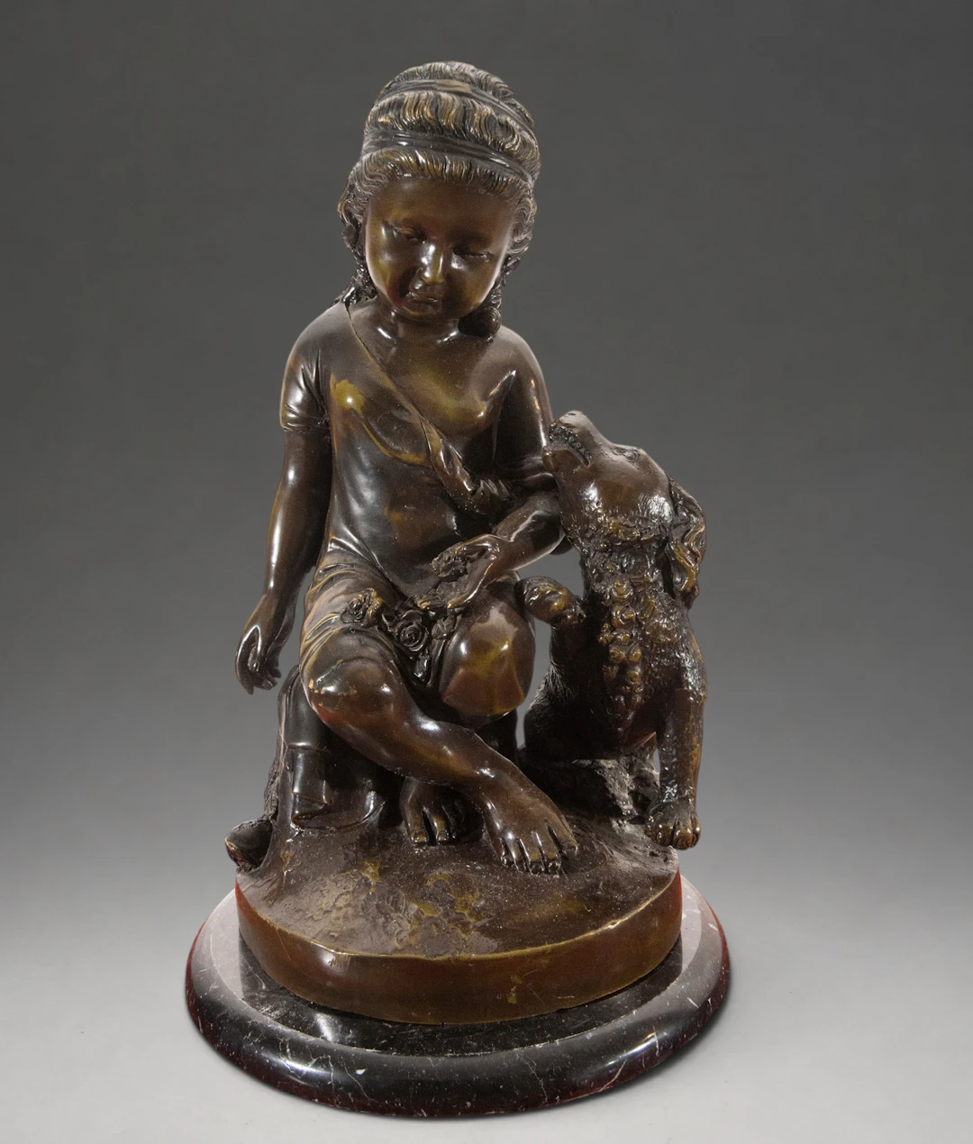 Girl sitting next to a lamb – 19th-20th century