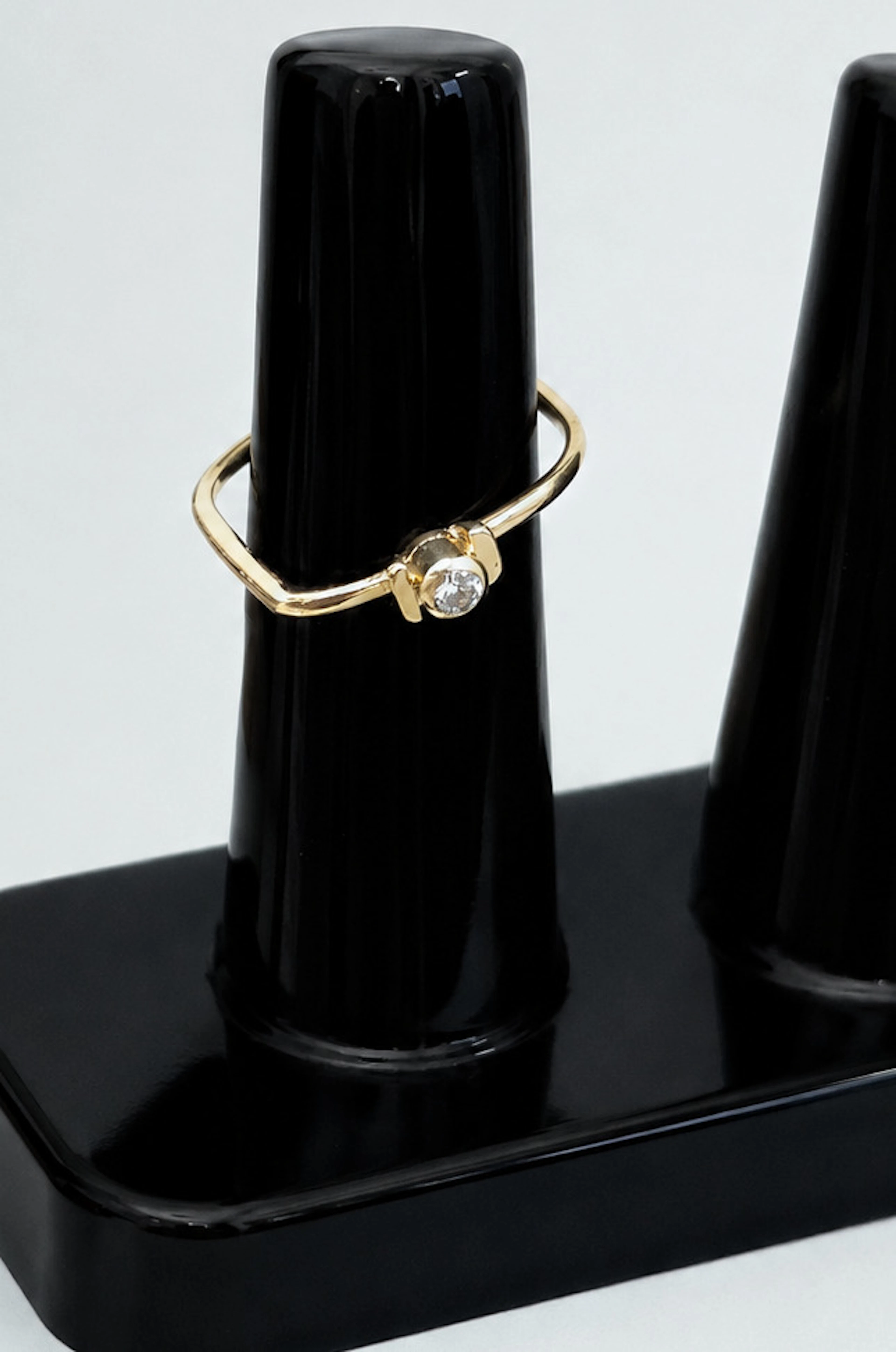 Minimalist 18-karat yellow gold solitaire ring with diamond