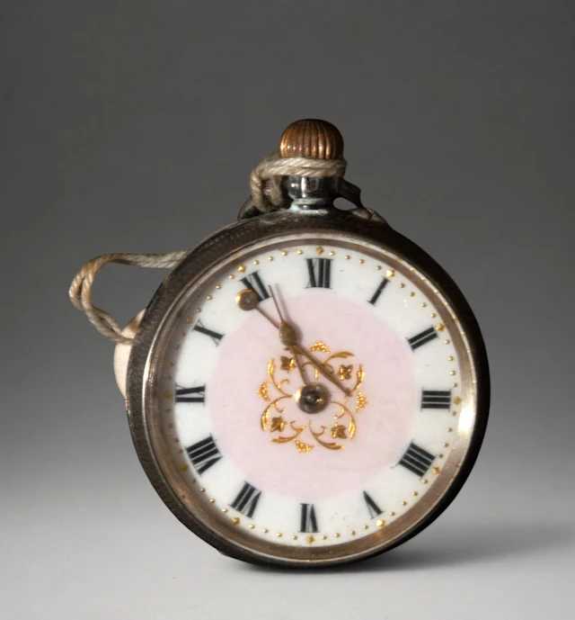 Miniature pocket watch with floral decoration