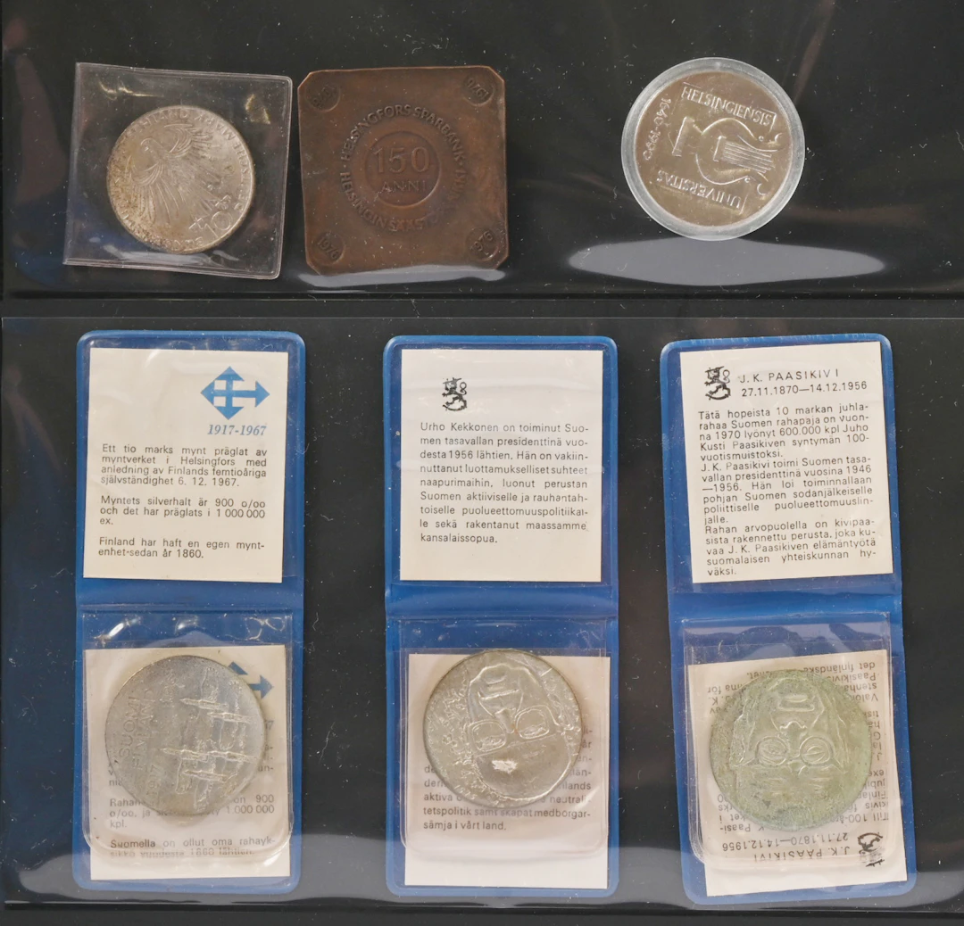 Silver commemorative coins one of 100 markka and three of 10 markka.