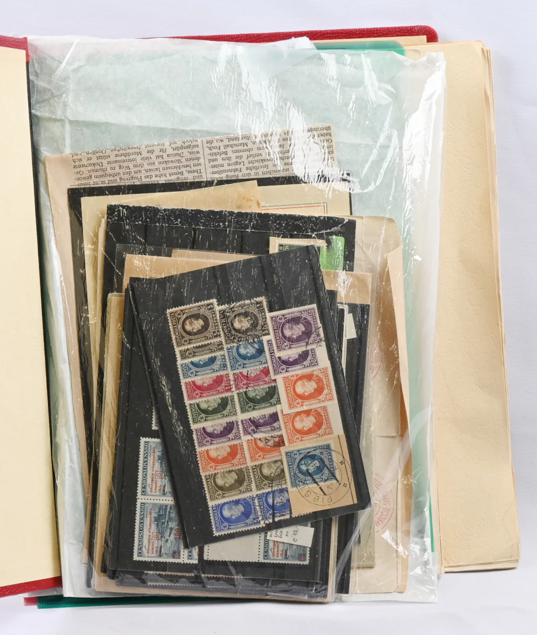 Mixed selection of war-time material in an album as well as on stockcards