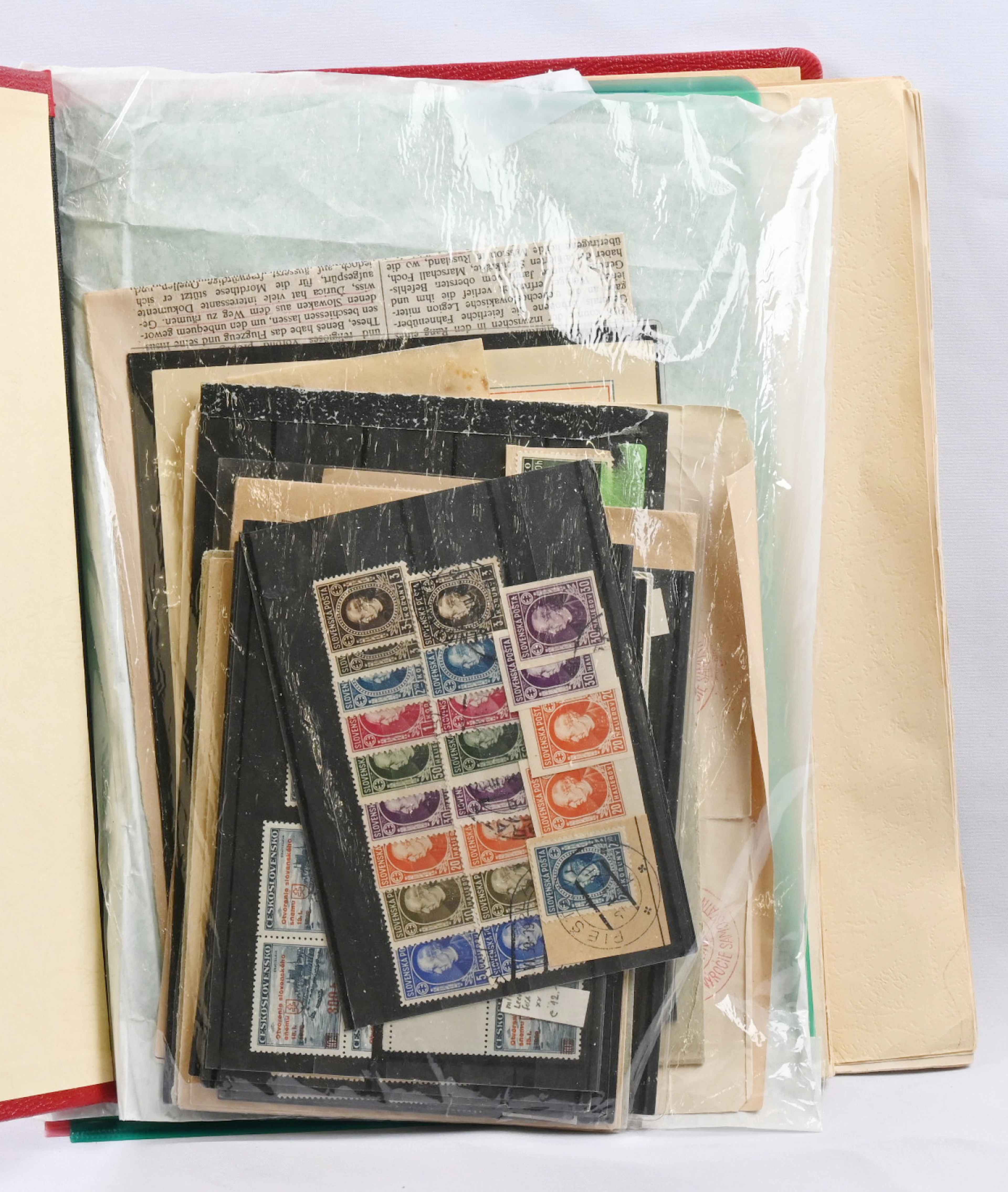 Mixed selection of war-time material in an album as well as on stockcards