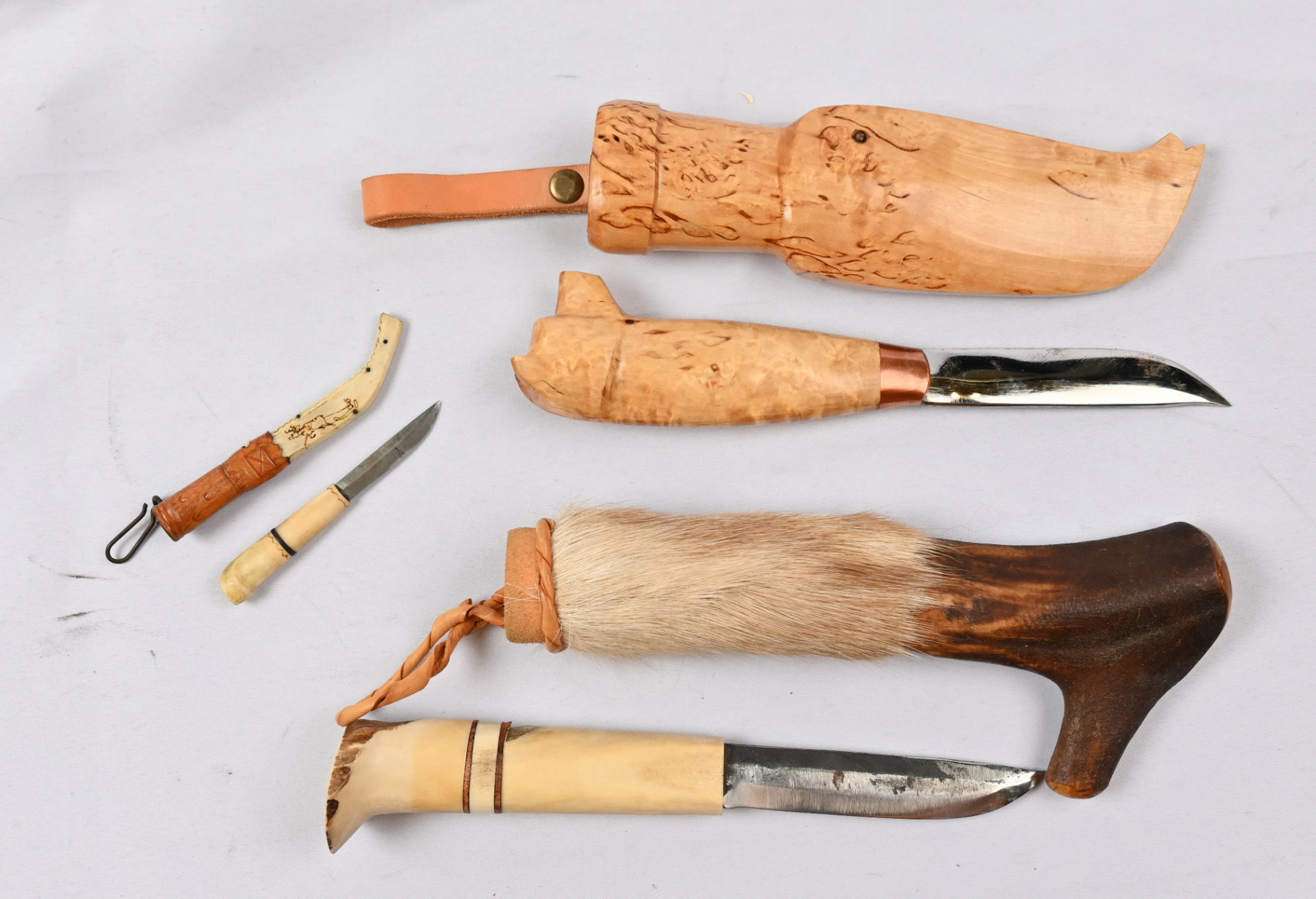 Three Finnish knives. One is a so-called presentation knife engravings
