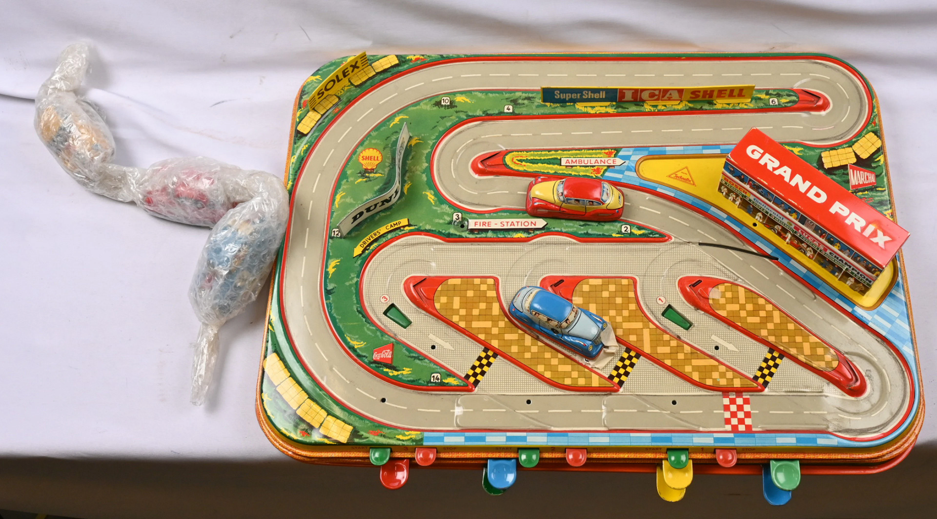 Toys, three mechanical play mats and five cars.