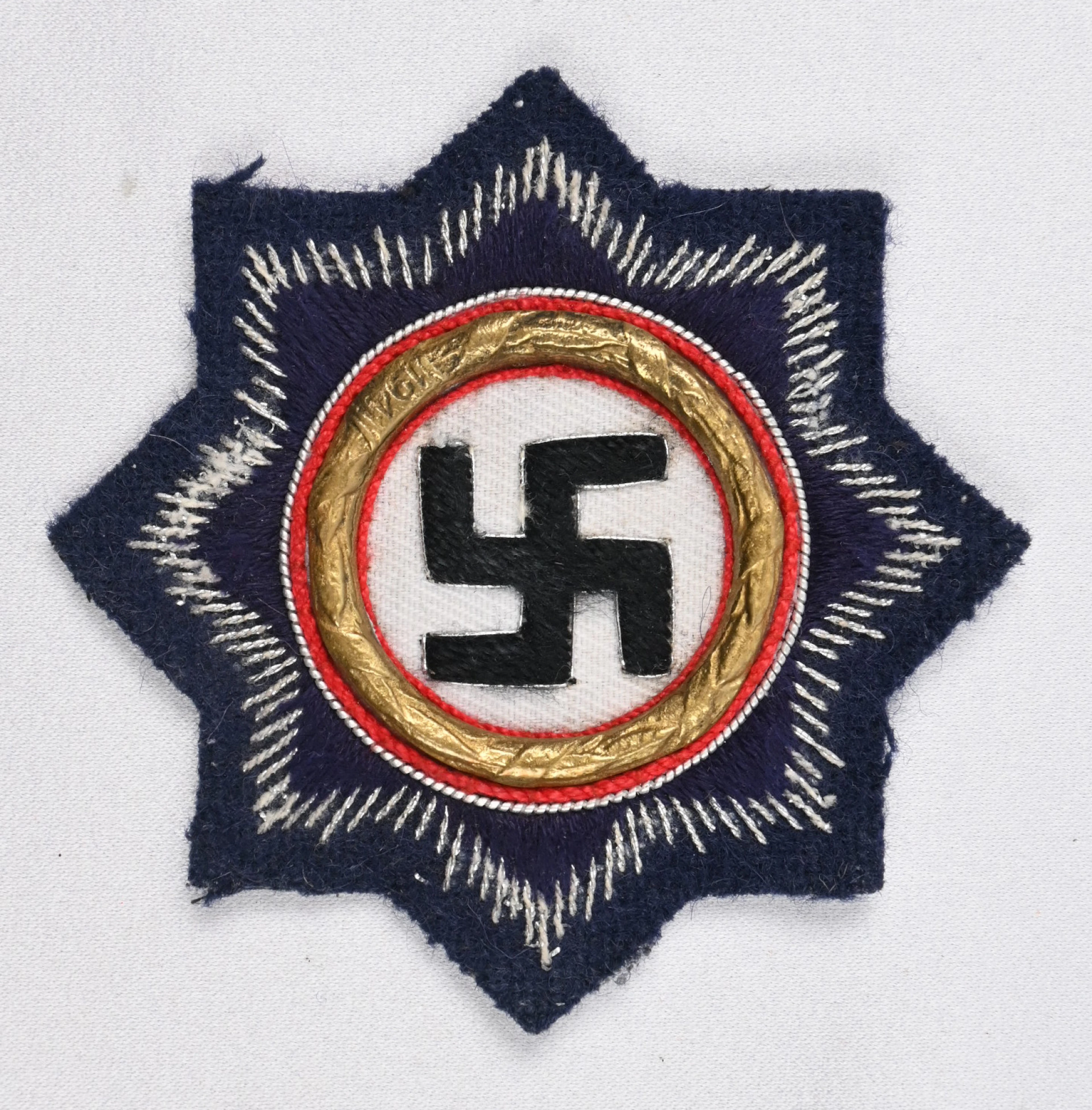 German ”German Cross in Gold”, embroidered version on navy cloth.
