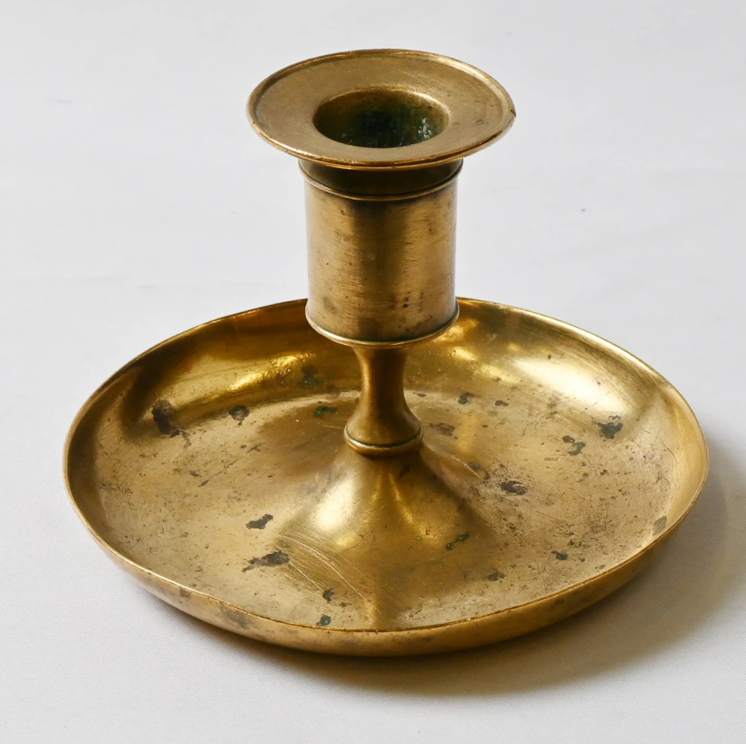 Fiskars, candlestick, brass, patina of age and got a little bump.