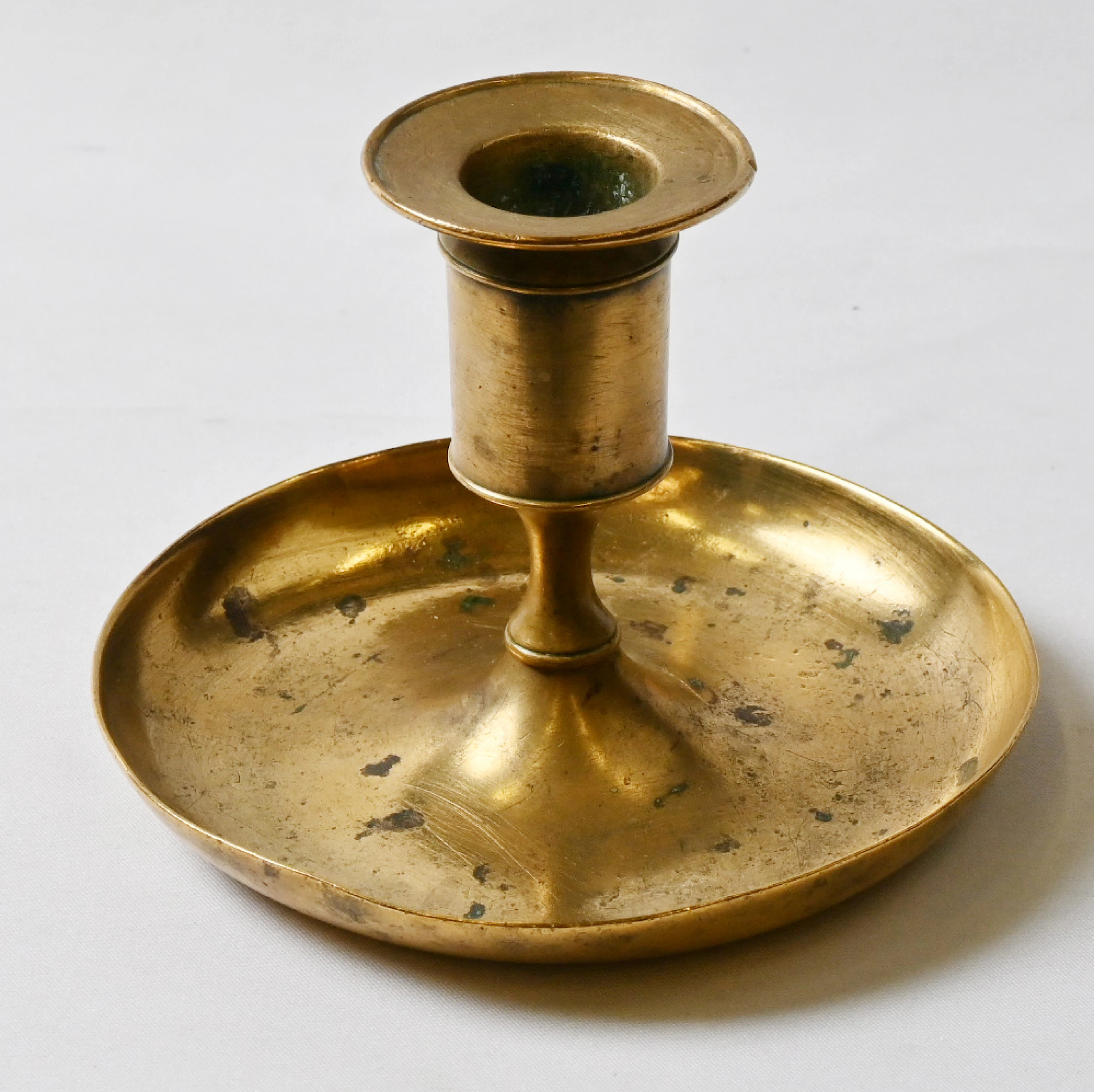 Fiskars, candlestick, brass, patina of age and got a little bump.
