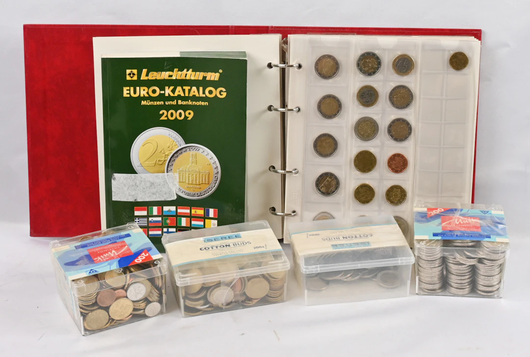 Euro coins large selection in an 8 KG box. In a small album and boxes