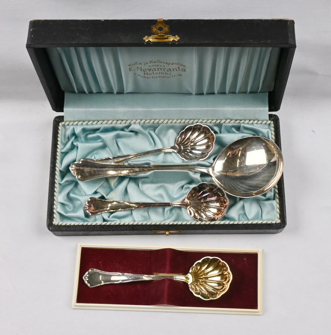 Chippendale sugar spoons three pieces and additionally a sauce ladle