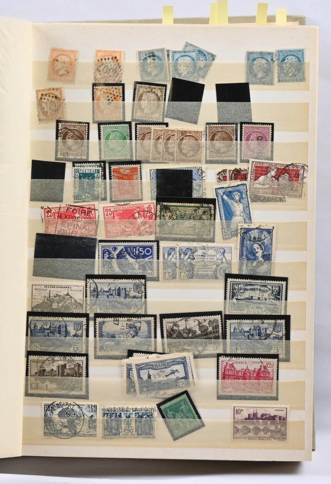 Stamp selection in a stockbook, part of the stamps removed but still