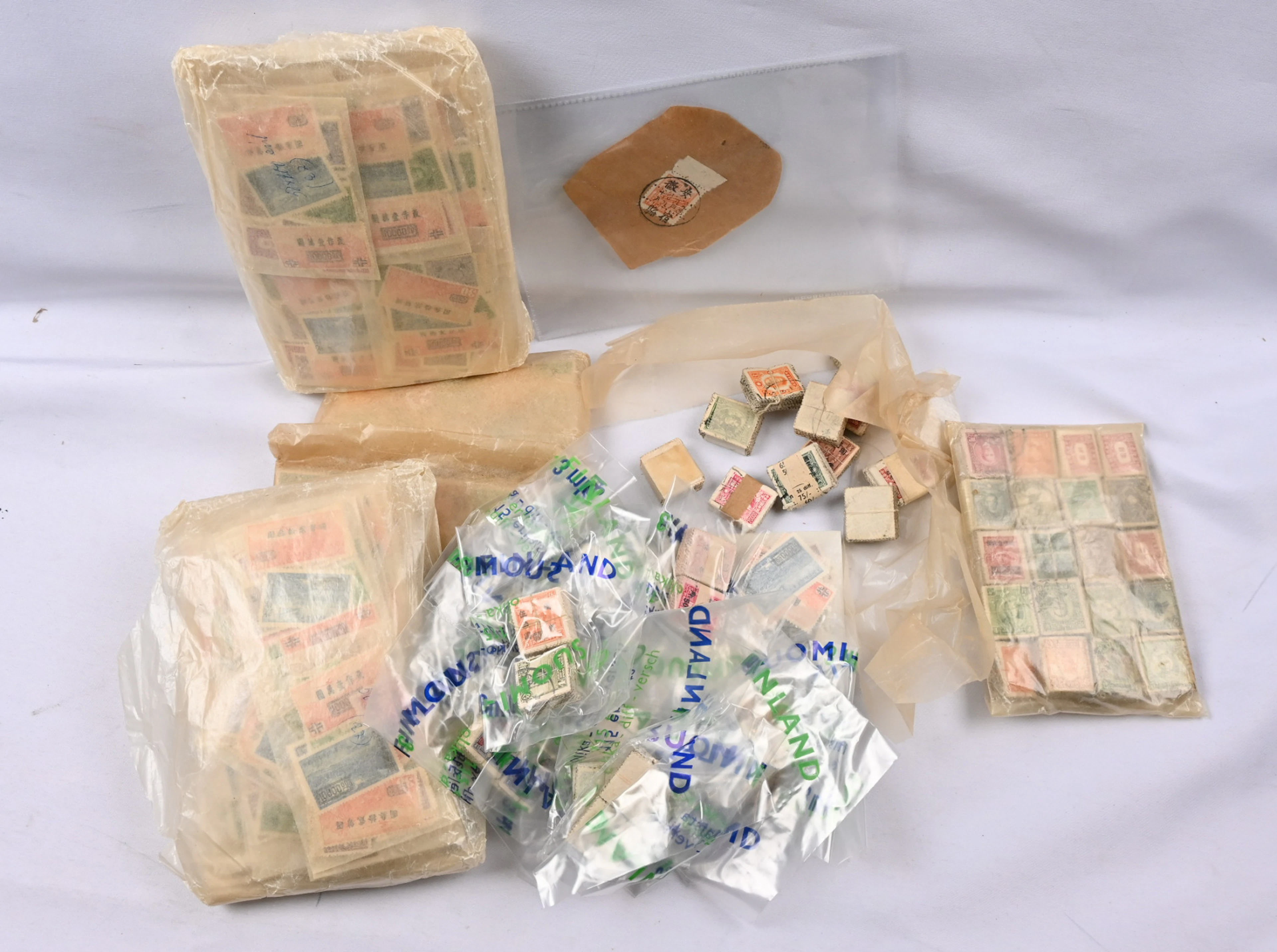 Old material in bundles of 100s and in glassines, made decades ago.