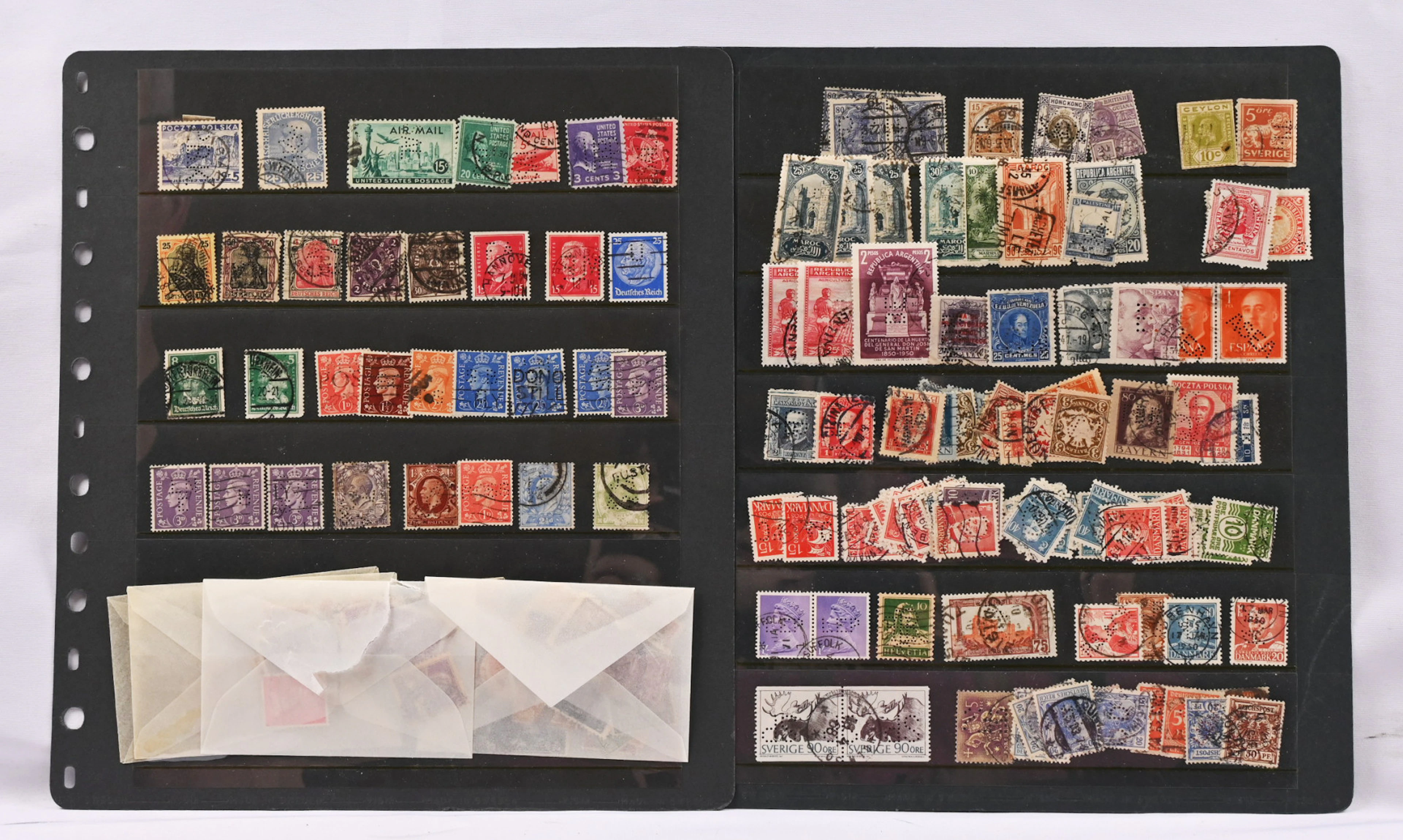 Perfins, large selection of stamps from various countries in eight
