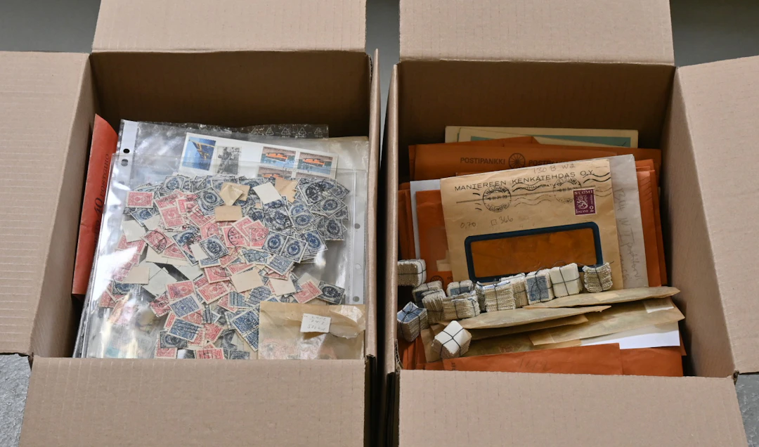 Finnish loose bulk stamps in envelopes and glassines in two boxes