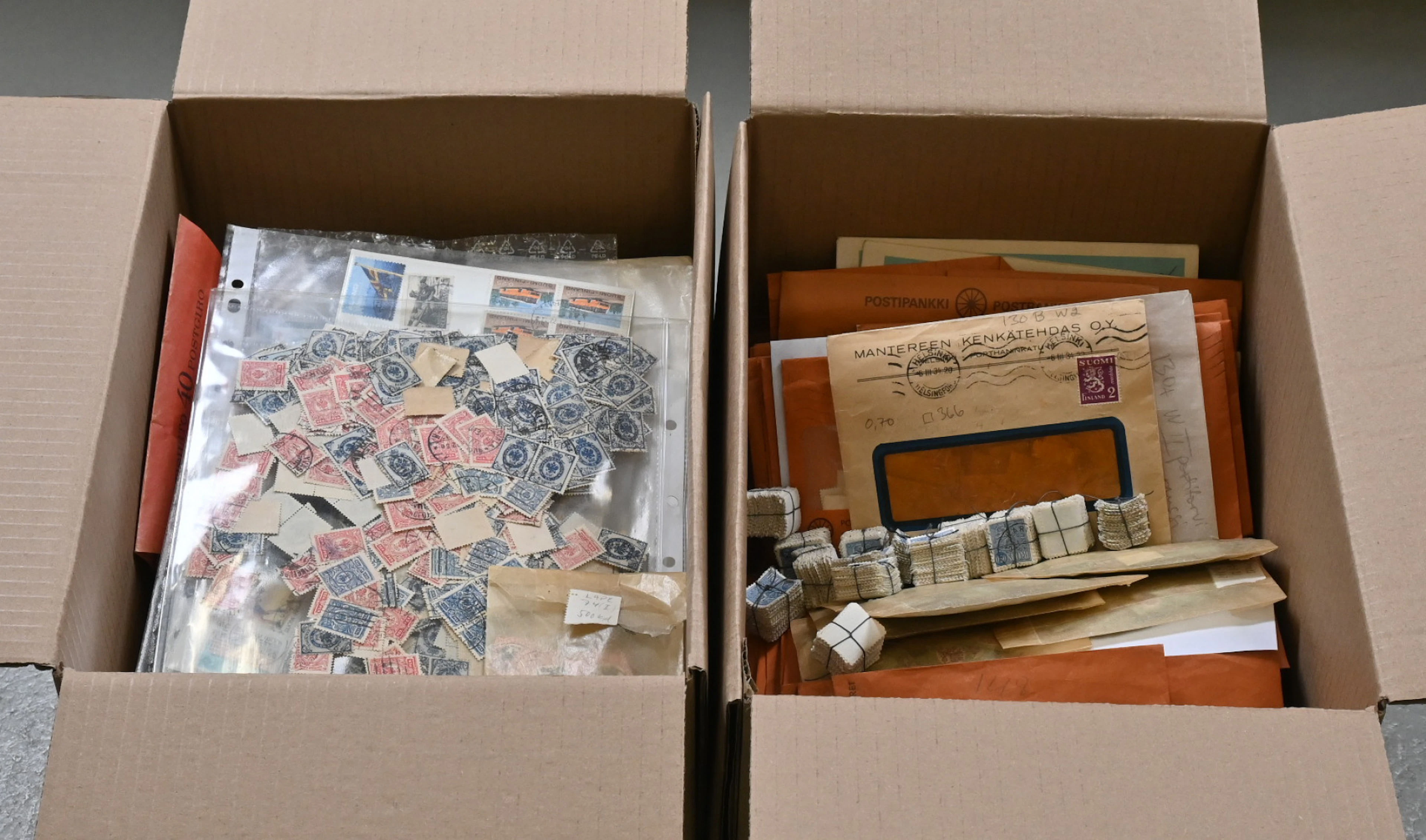 Finnish loose bulk stamps in envelopes and glassines in two boxes