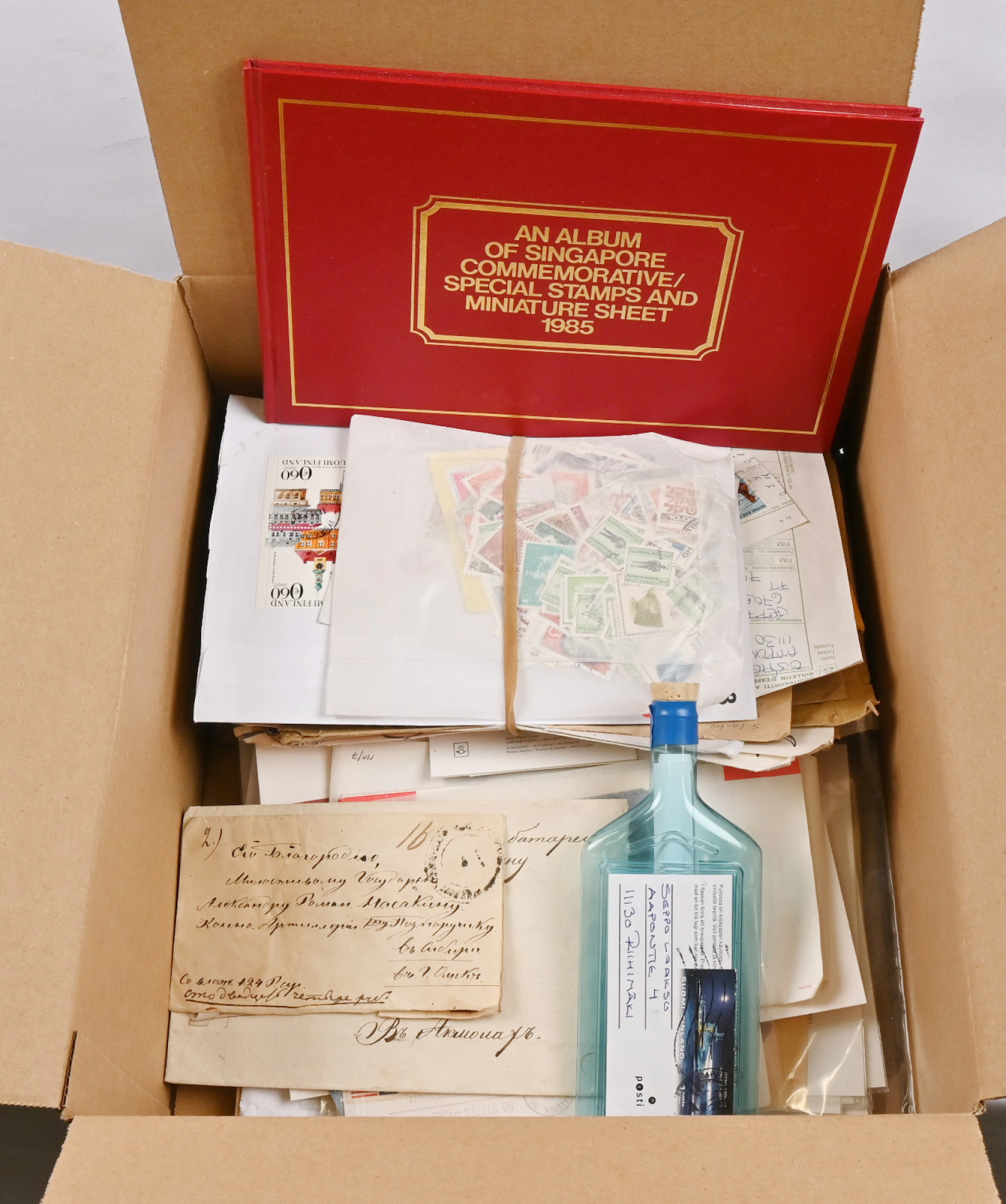 Box including small mixed selection of foreign and Finnish material