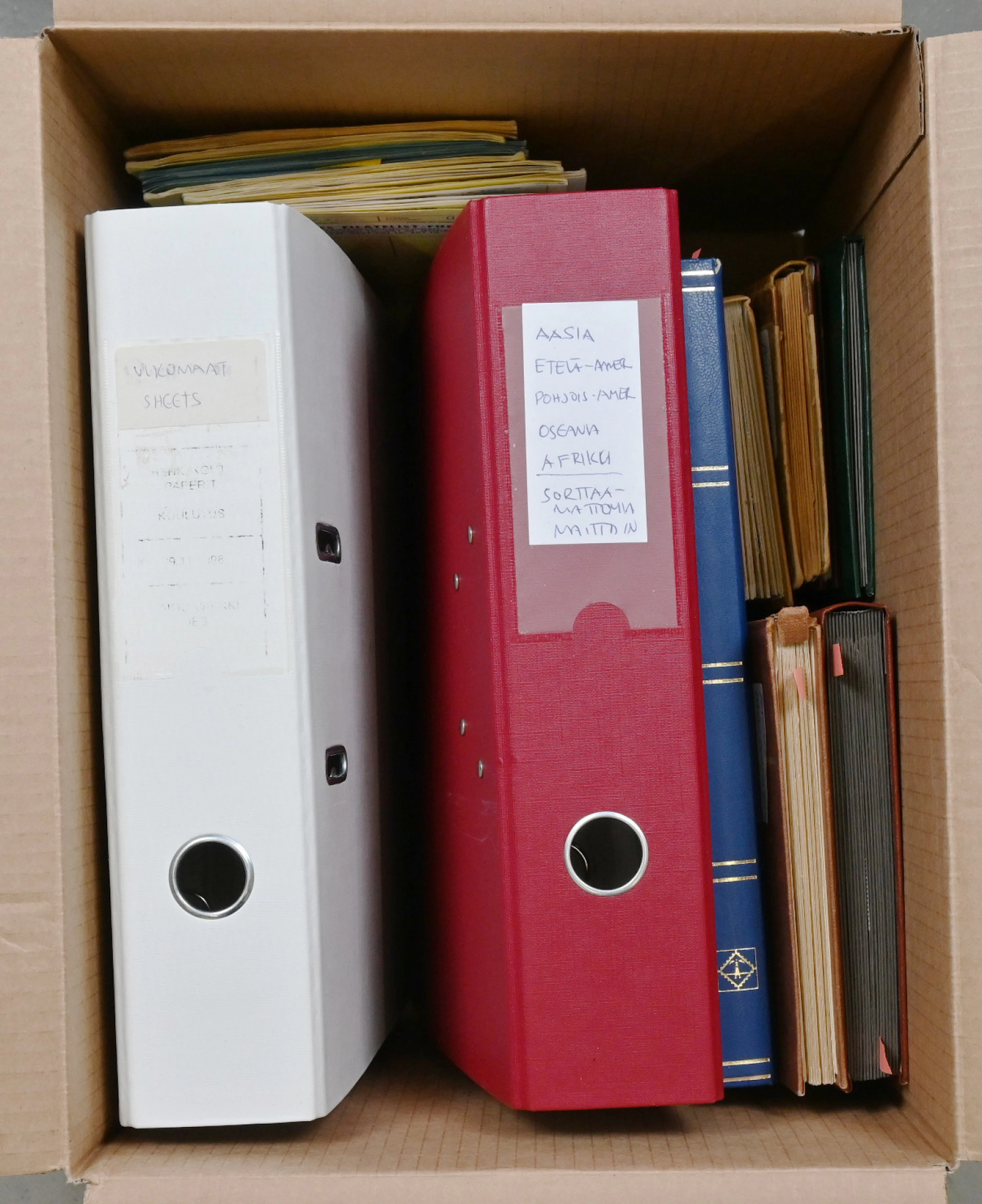Mixed selection of worldwide material in two thick binders, in small