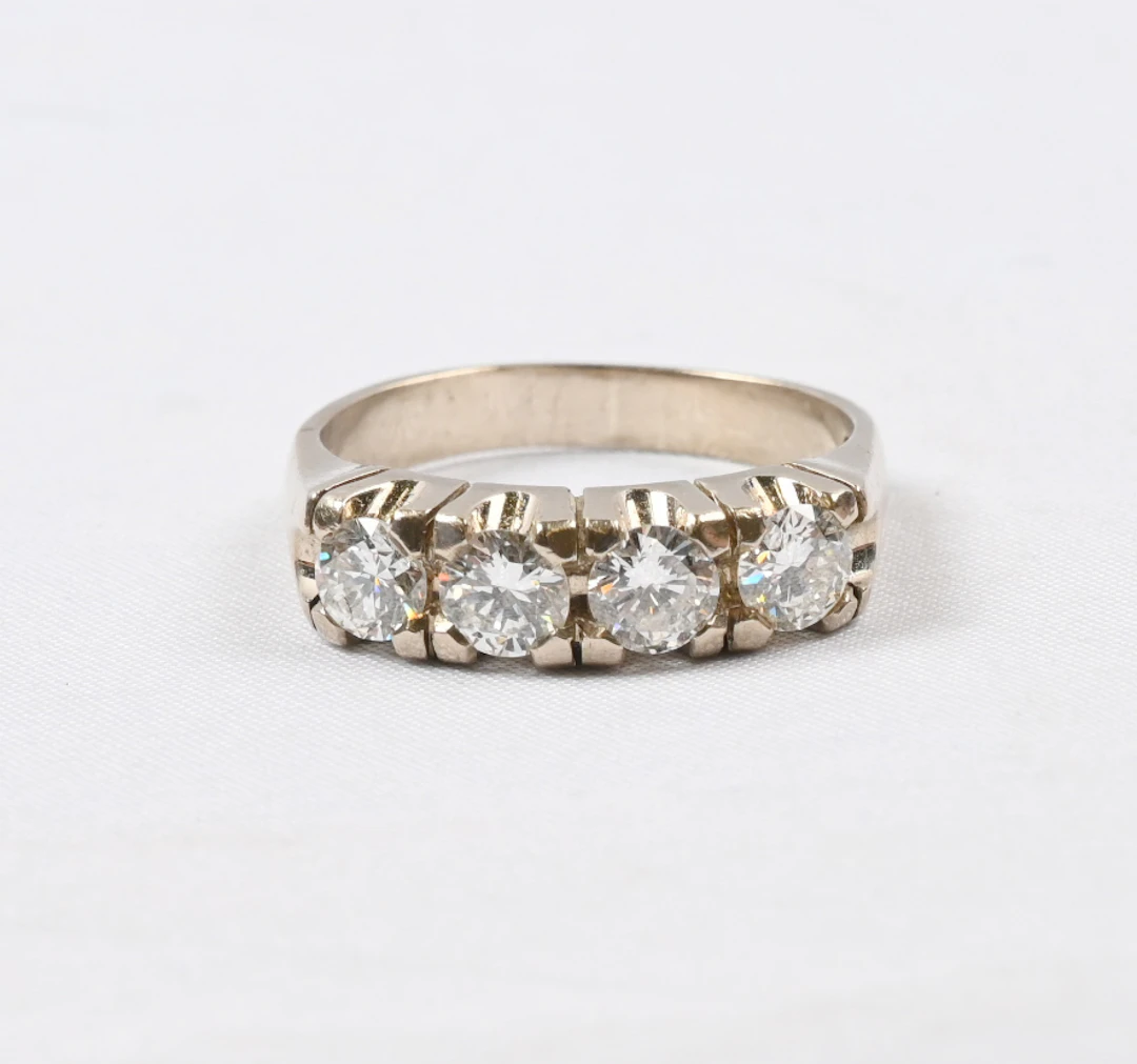 Dazzlingly magnificent white gold row diamond ring with four diamonds: