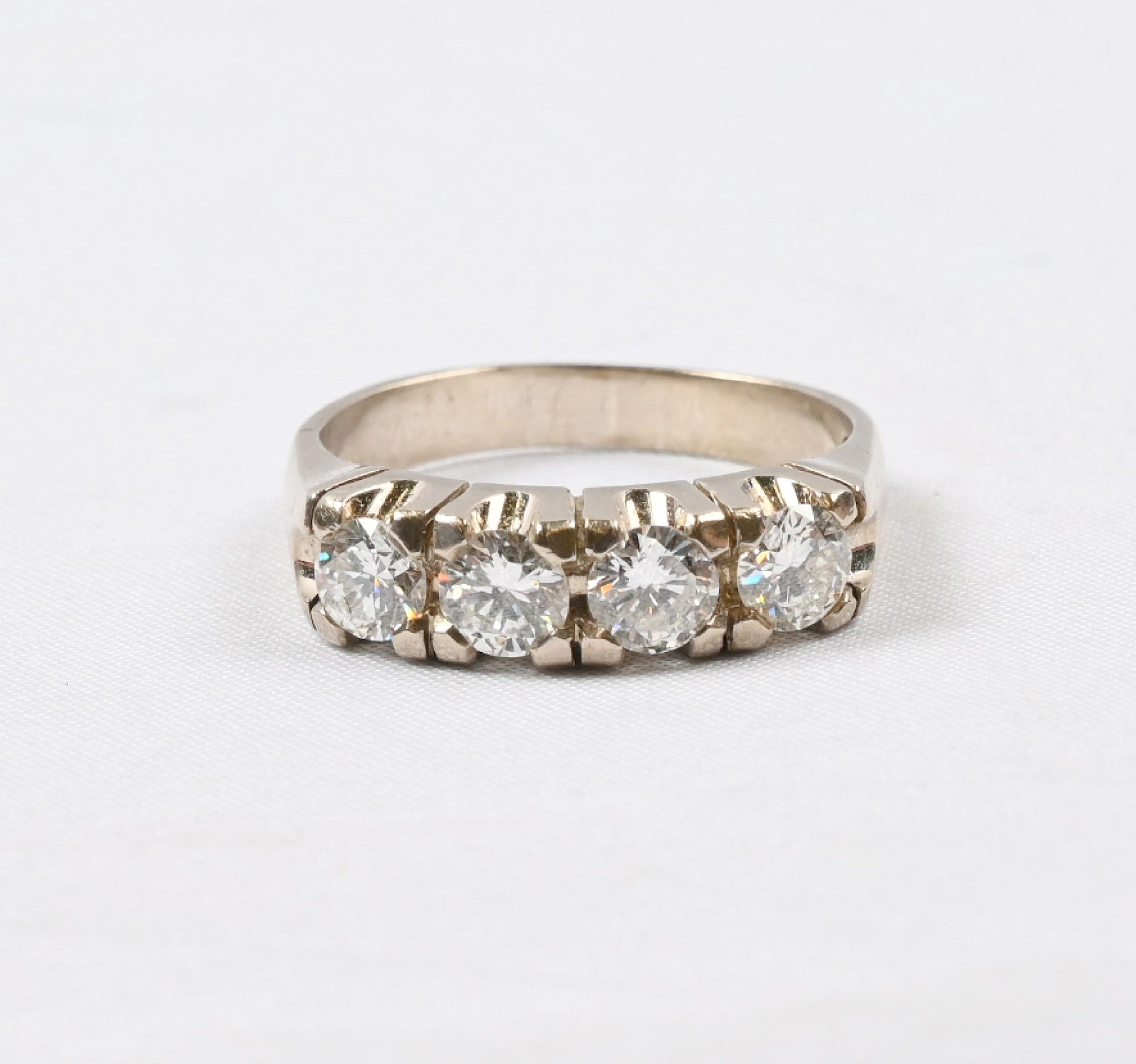 Dazzlingly magnificent white gold row diamond ring with four diamonds:
