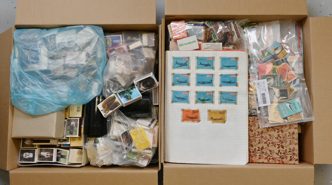 Mixed selection of matchbox labels and matchboxes in two boxes, total